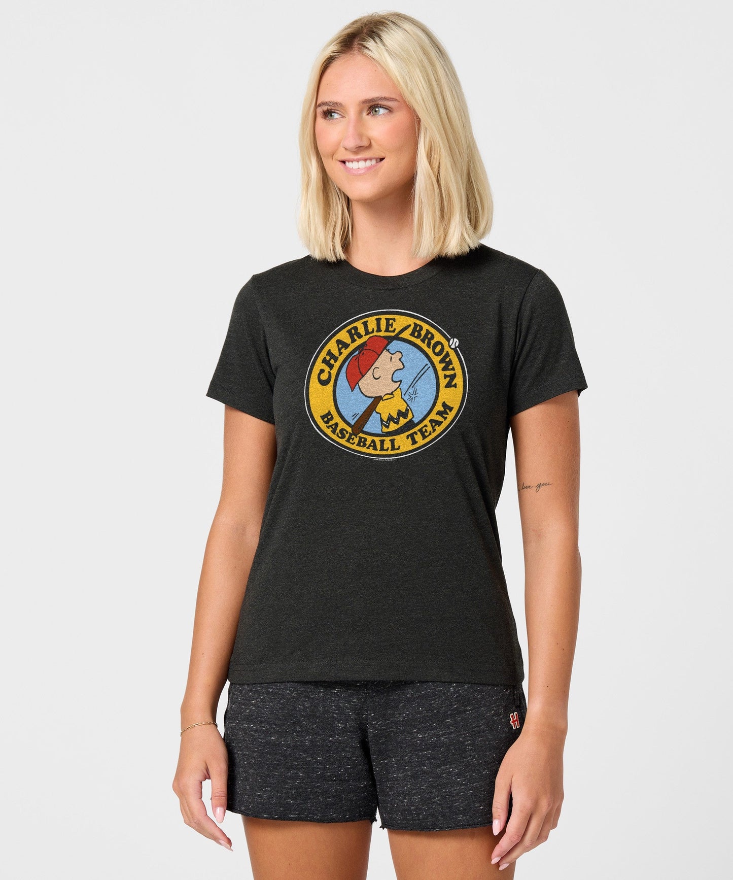 Side view of the women's graphic tee showing the standard fit and short sleeves