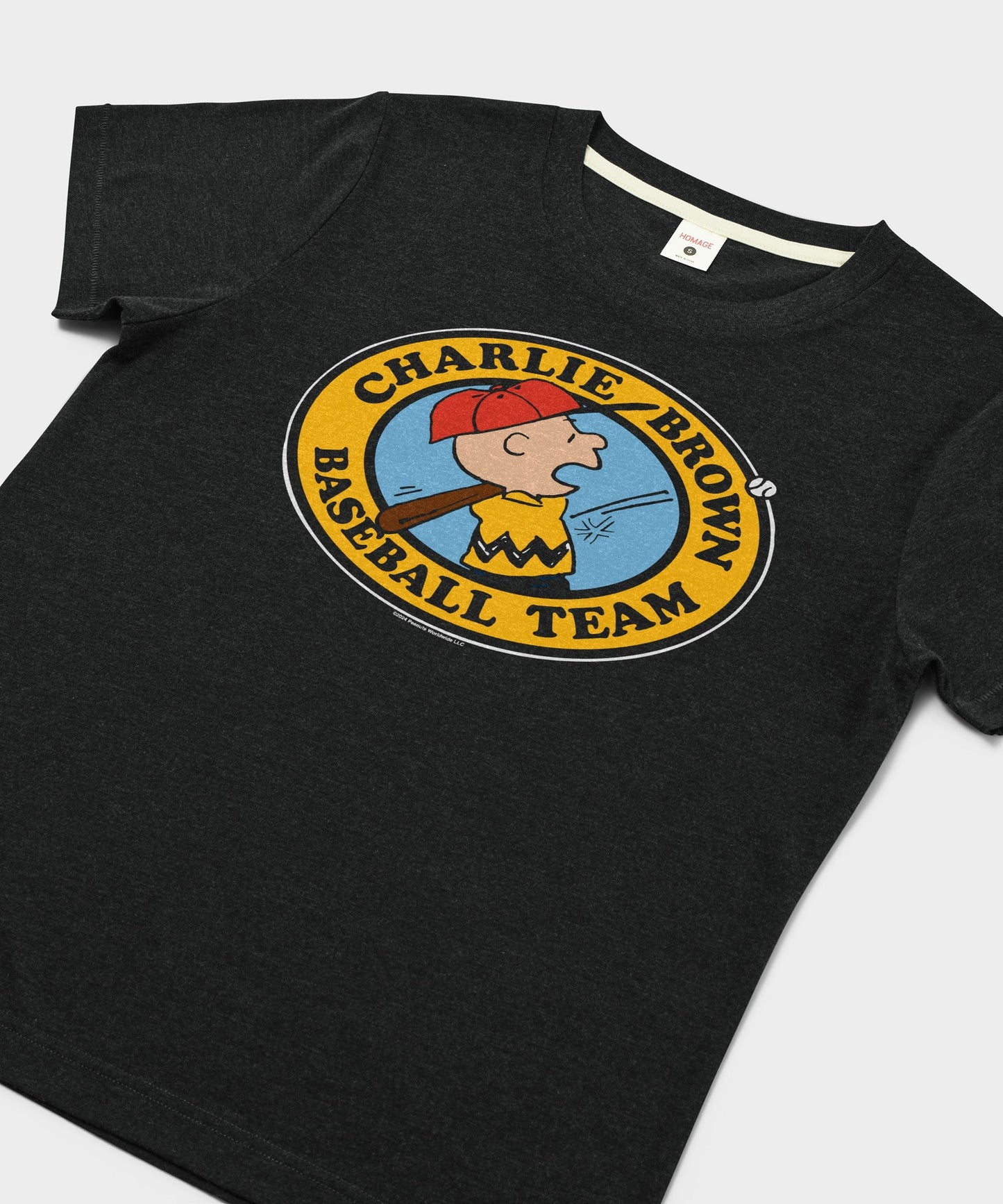 Close-up of the vintage-style Charlie Brown baseball team print on the charcoal fabric