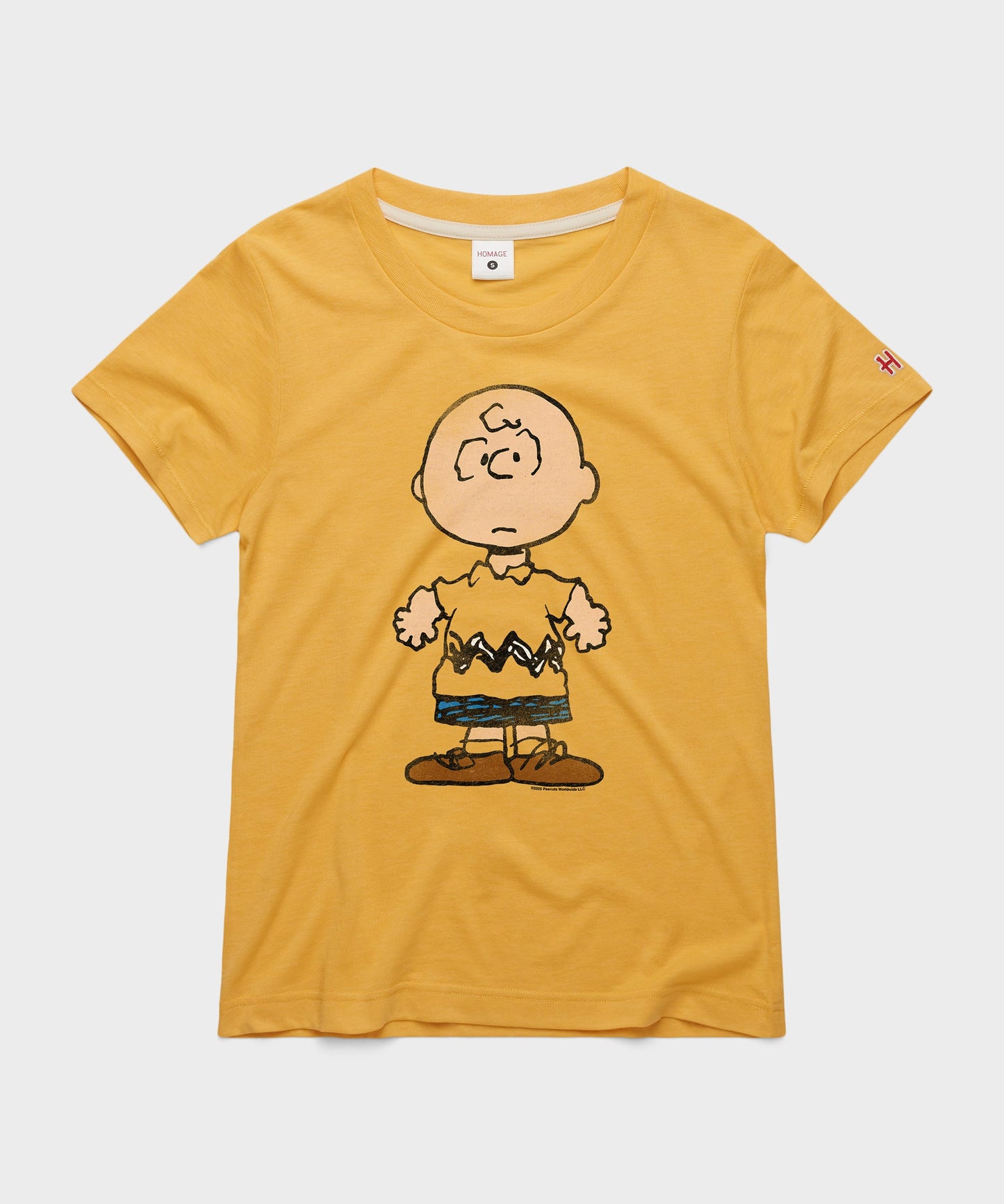 Gold women's t-shirt featuring a vintage graphic of Charlie Brown centered on the front
