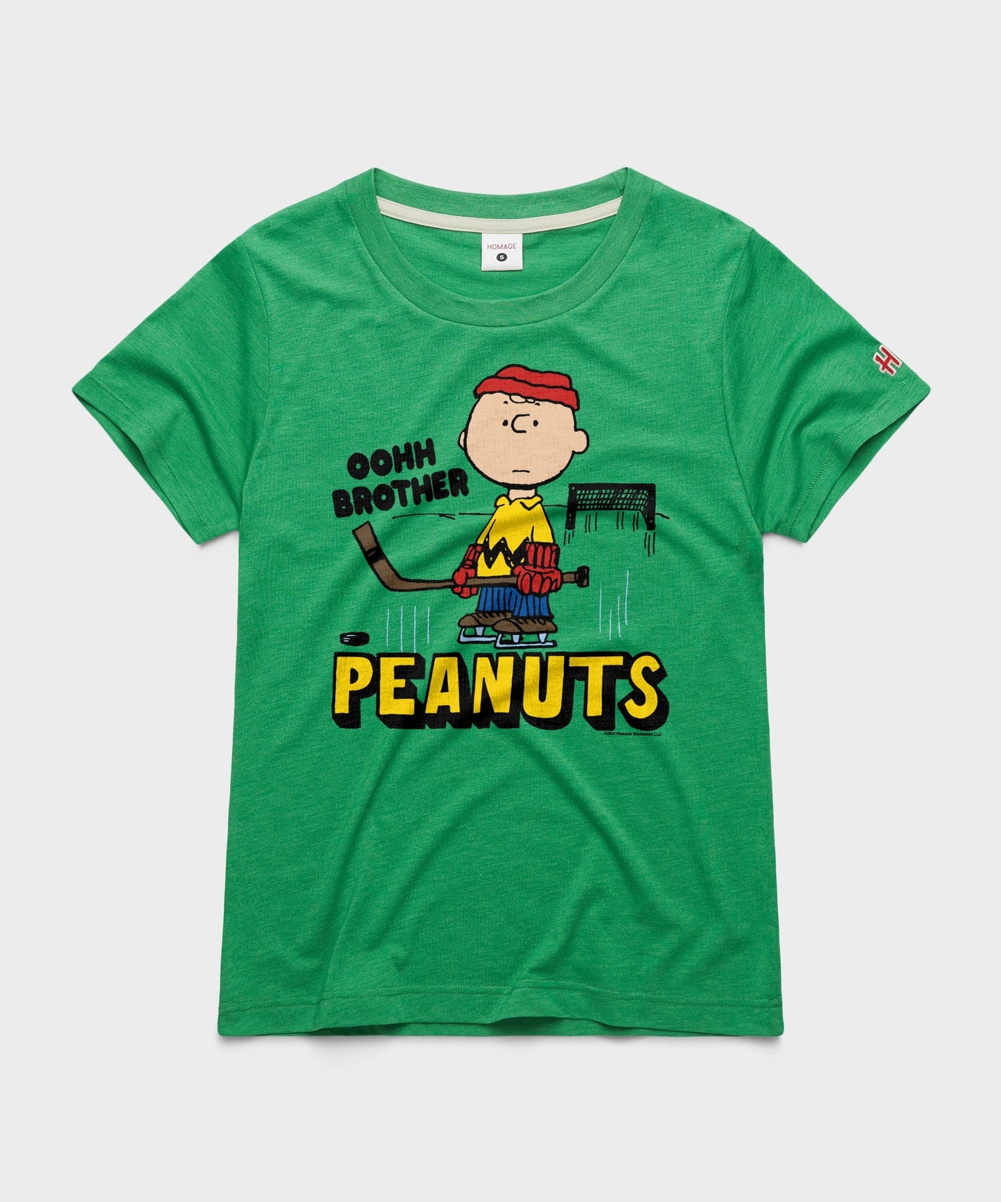 Green women's crewneck t-shirt with a vintage Charlie Brown skating graphic centered on the chest