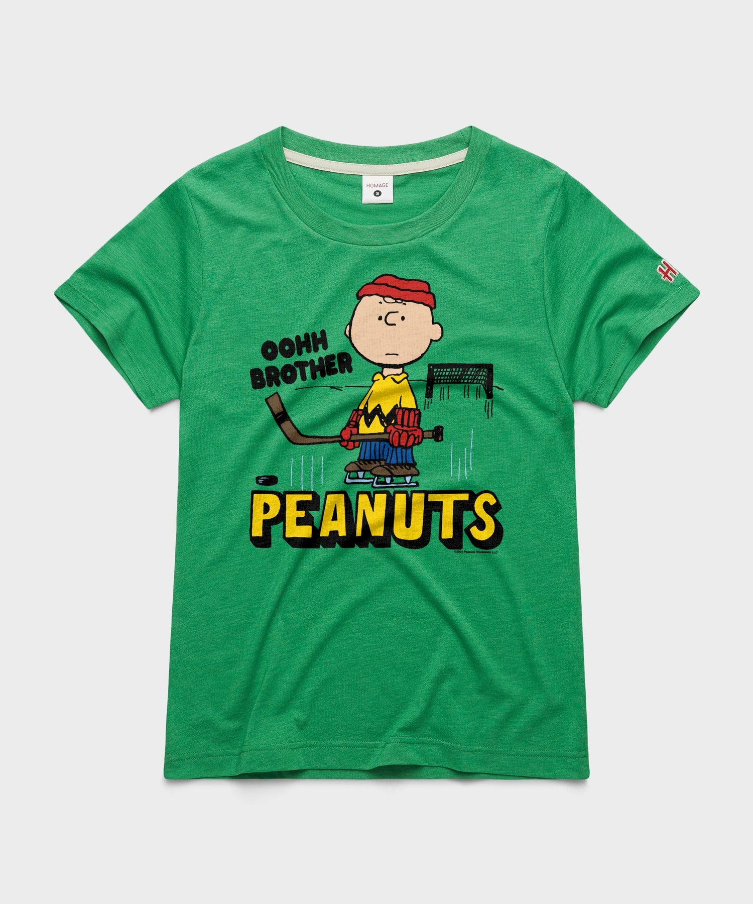 Green women's crewneck t-shirt with a vintage Charlie Brown skating graphic centered on the chest