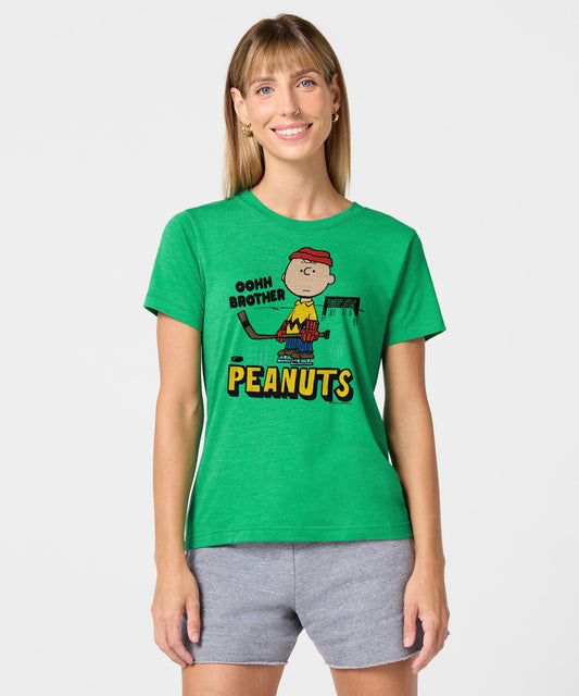 Green women's crewneck t-shirt with a vintage Charlie Brown skating graphic centered on the chest-2