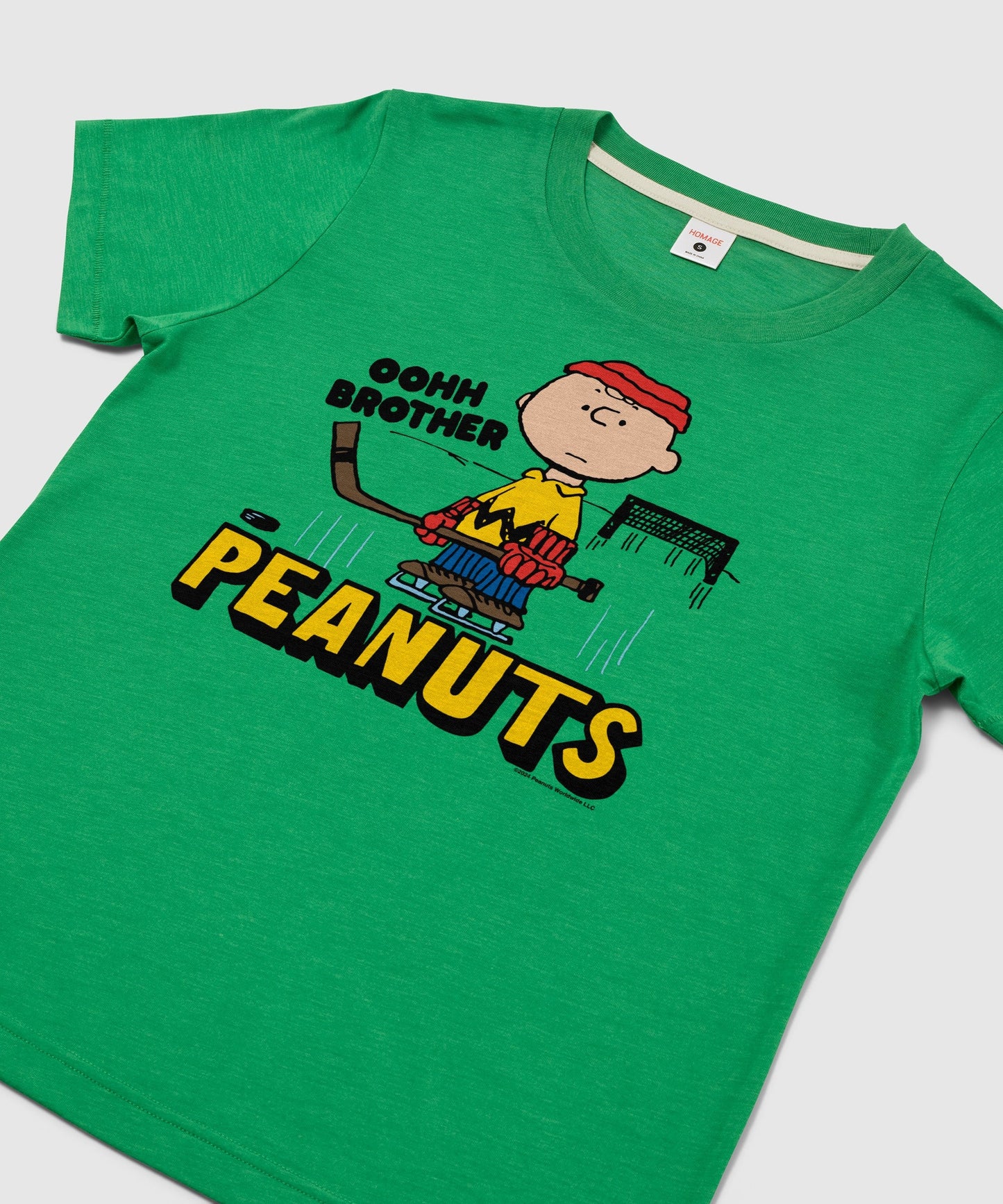 Close-up of the Charlie Brown Oohh Brother graphic printed on the green t-shirt front
