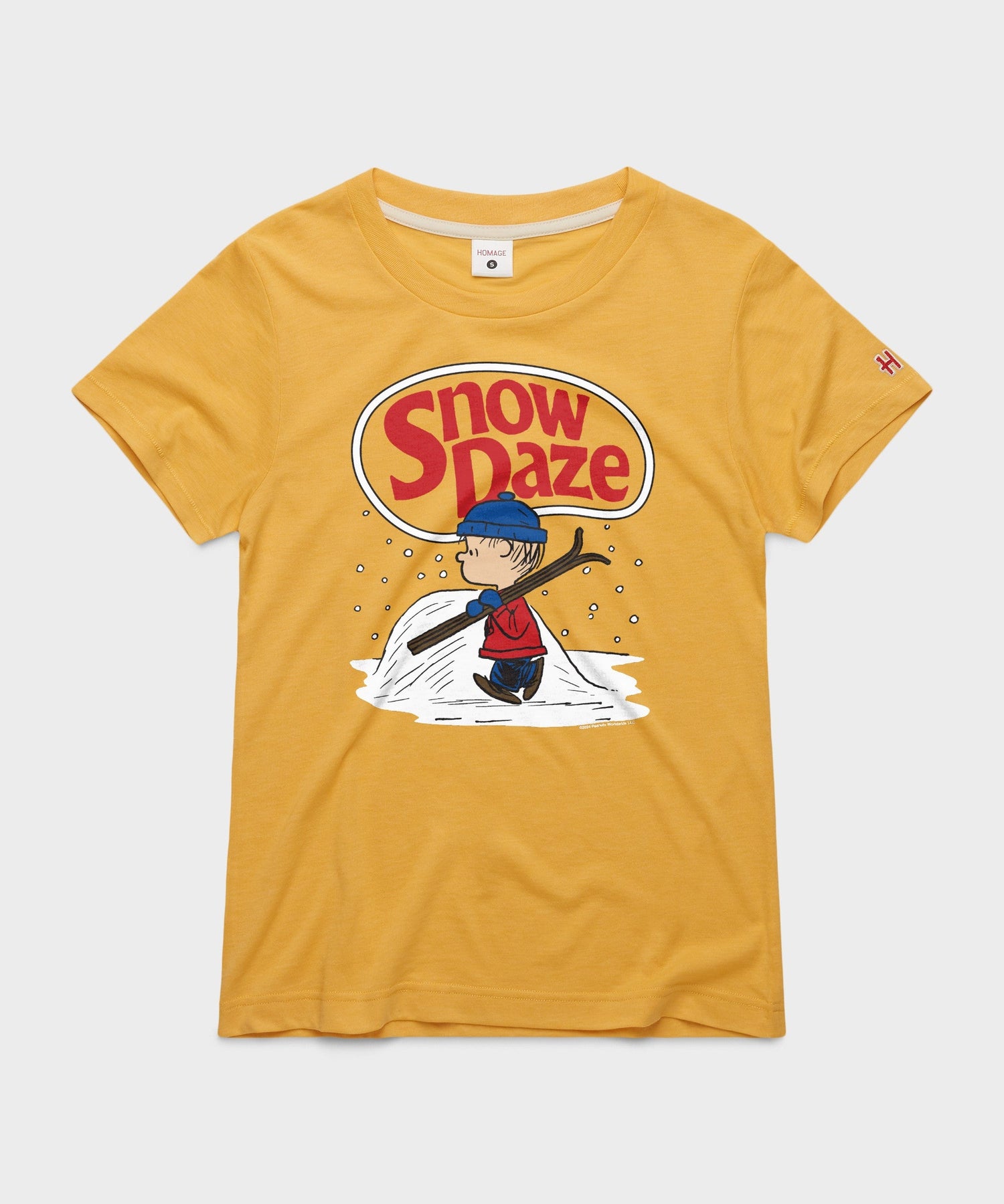 Gold crewneck sweatshirt featuring Linus holding his blue blanket amidst falling snowflakes on the front chest