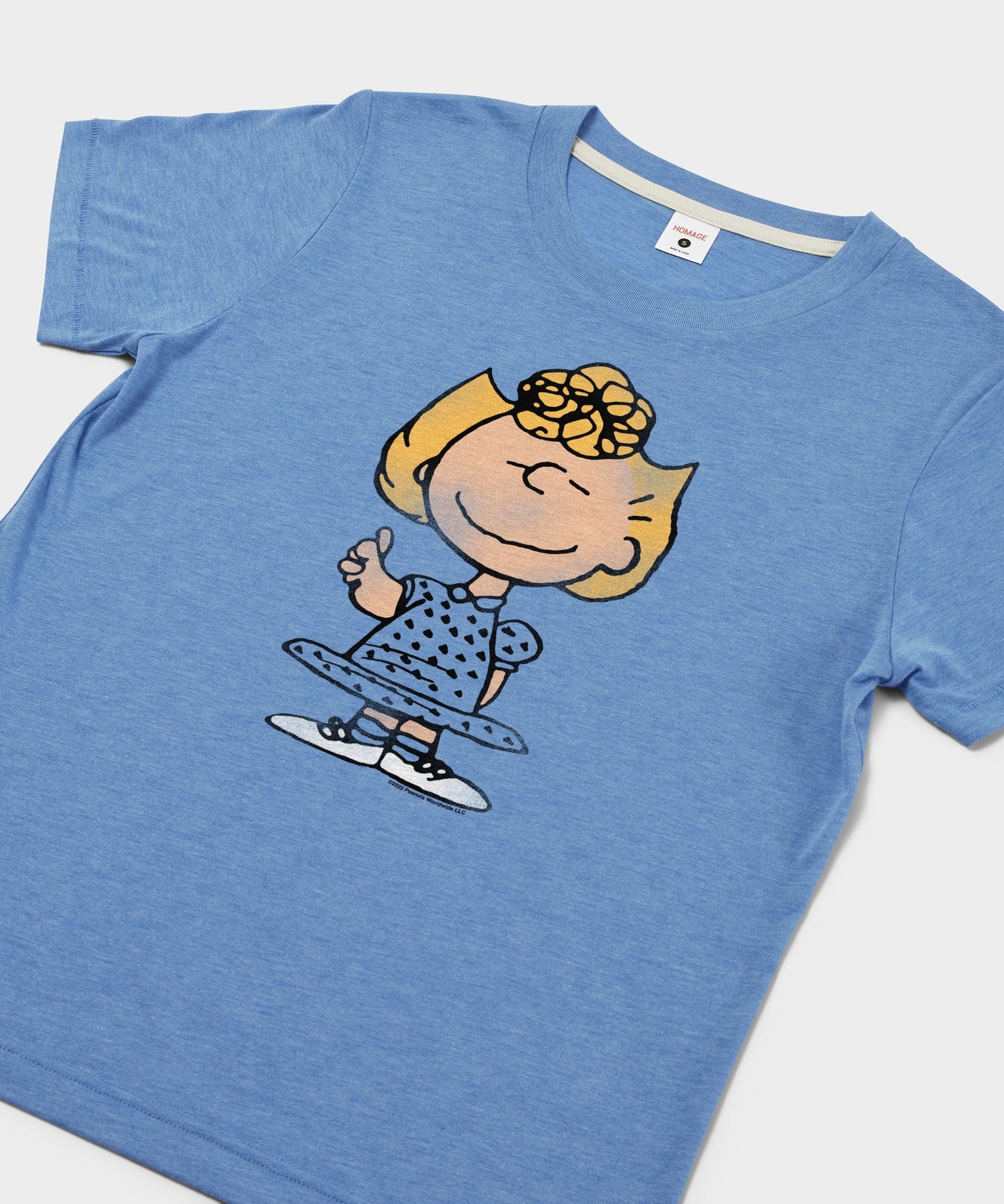 Close-up of the Sally Brown character graphic on the light blue t-shirt