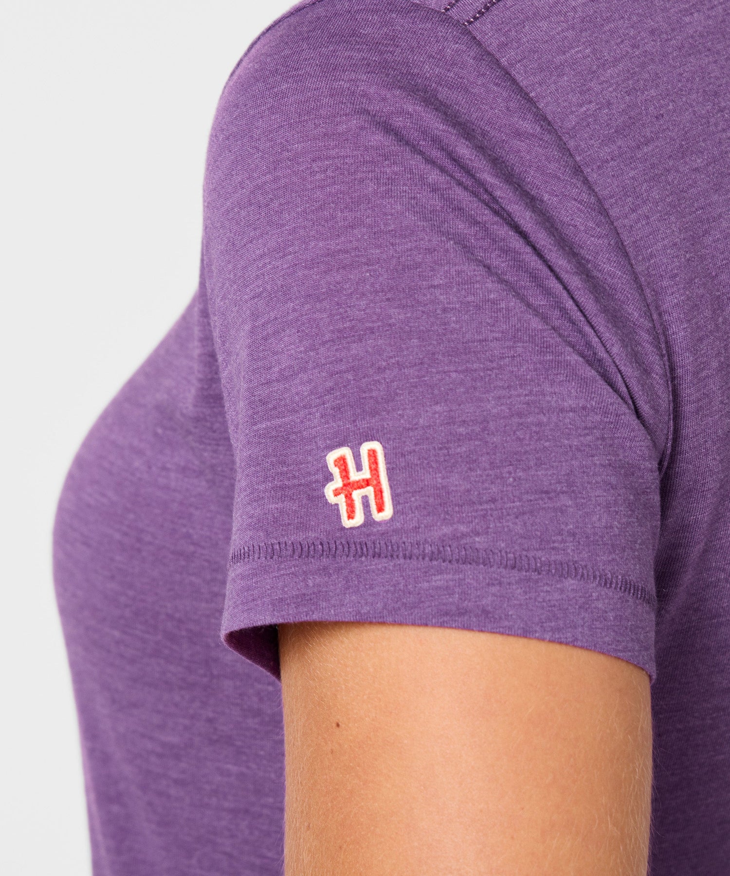Folded view of the royal purple Peanuts t-shirt