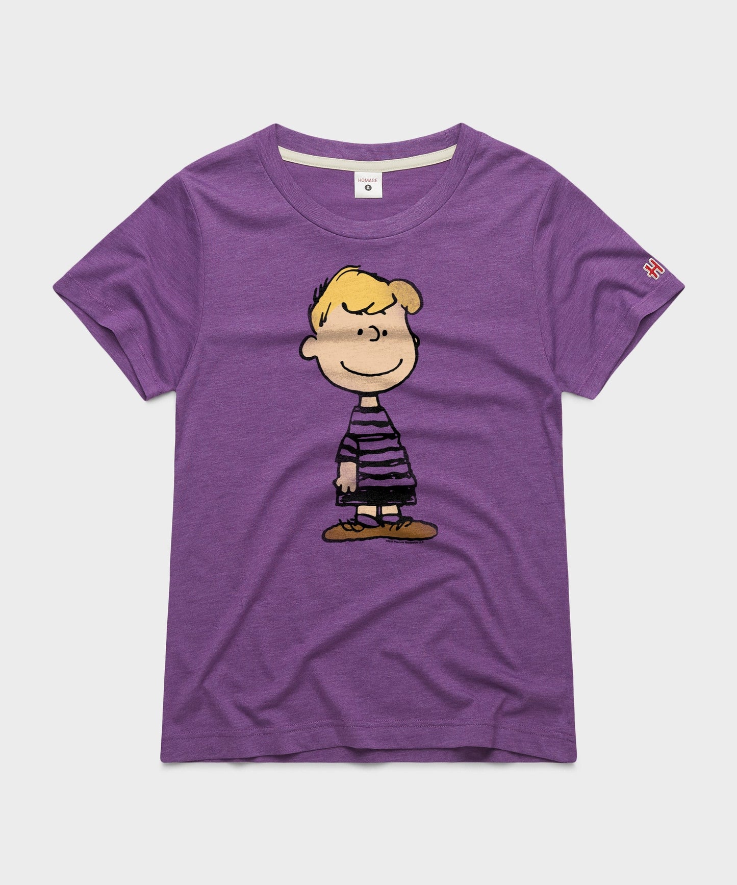 Royal purple women's t-shirt featuring Schroeder playing his toy piano on the front chest