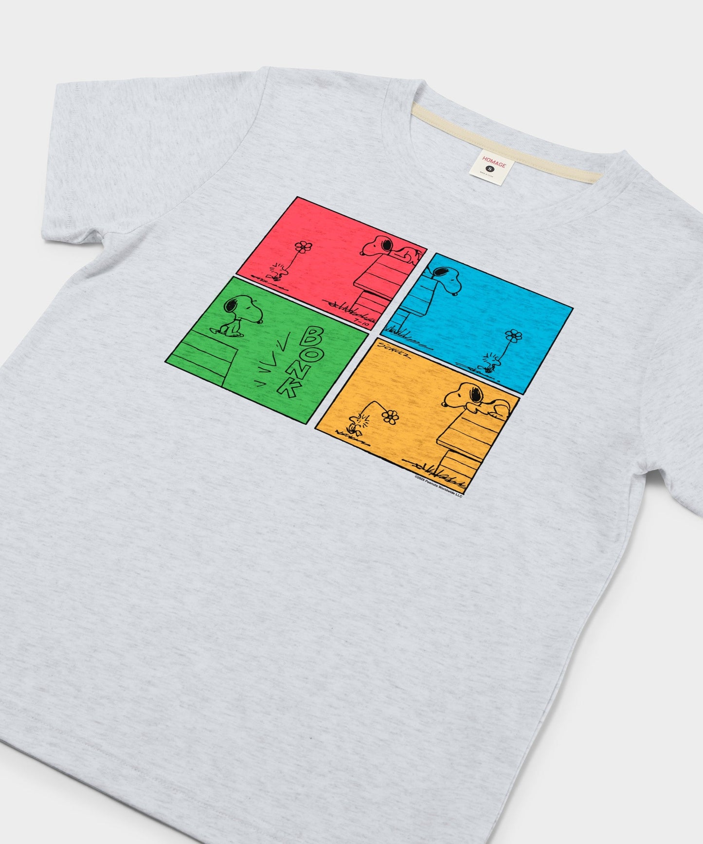 Close-up view of the Snoopy and Woodstock comic panel graphic printed on the chest