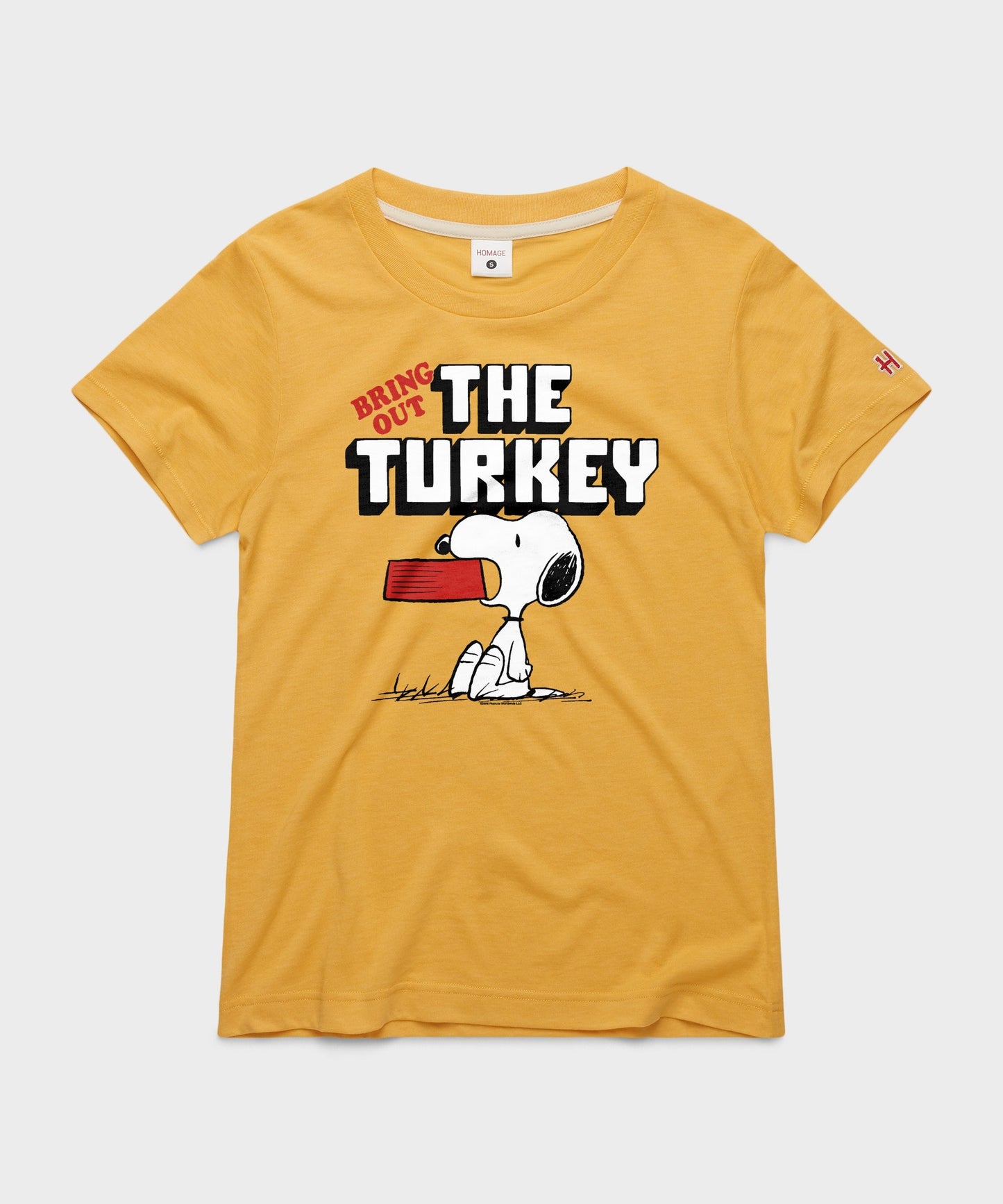 Gold women's t-shirt featuring Charlie Brown graphic on the front center