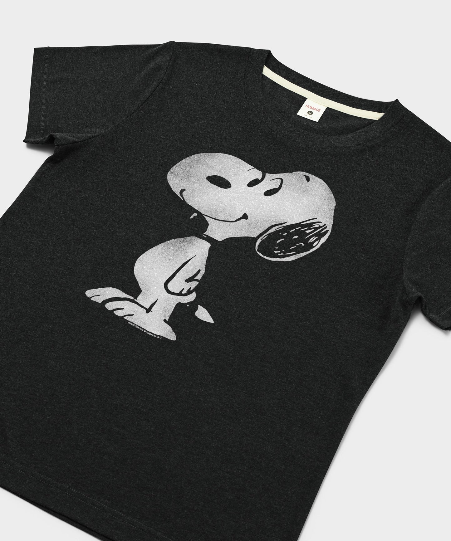 Close-up of the Snoopy graphic printed on the front of the charcoal t-shirt
