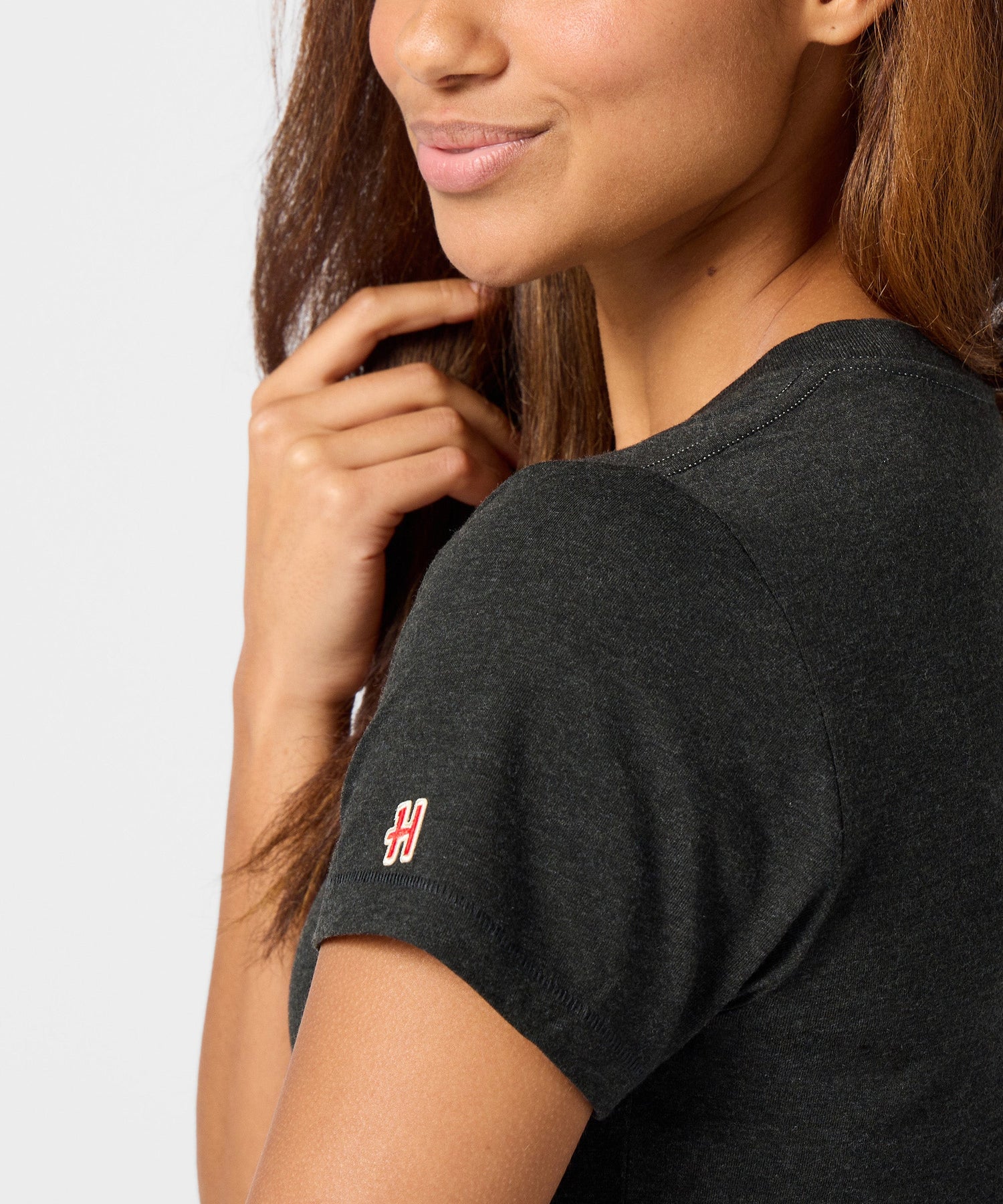 Folded charcoal t-shirt showing the soft fabric texture and seasonal graphic