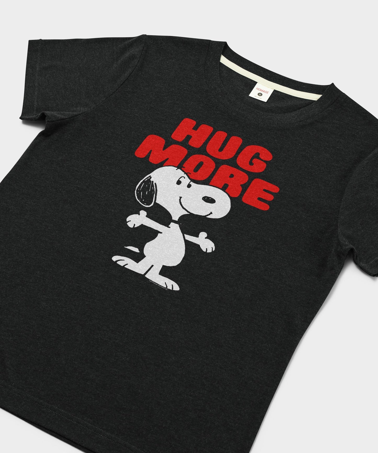 Close-up of the Snoopy and Woodstock Hug More graphic on the charcoal t-shirt