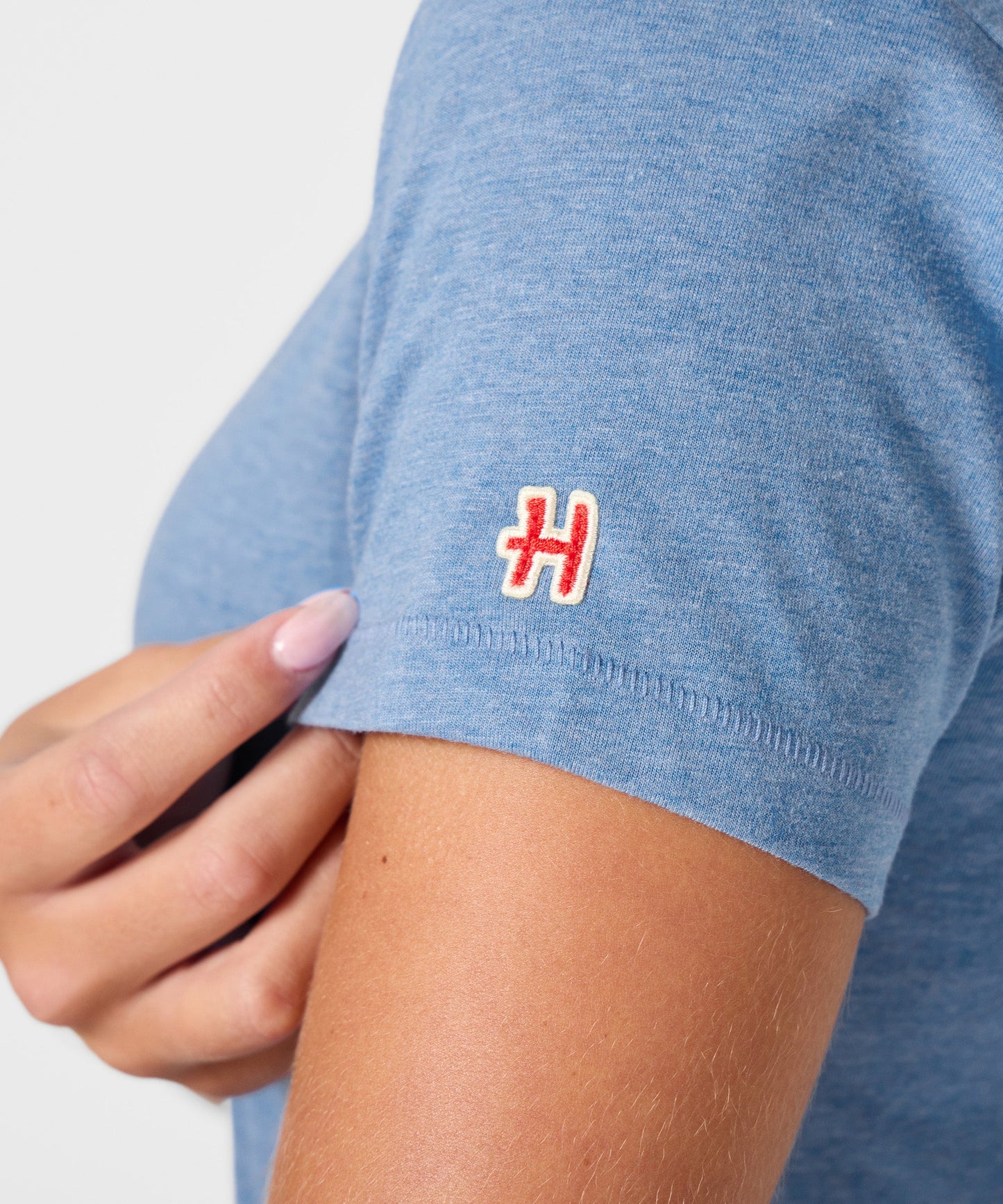 Folded light blue Peanuts t-shirt showing the soft fabric texture