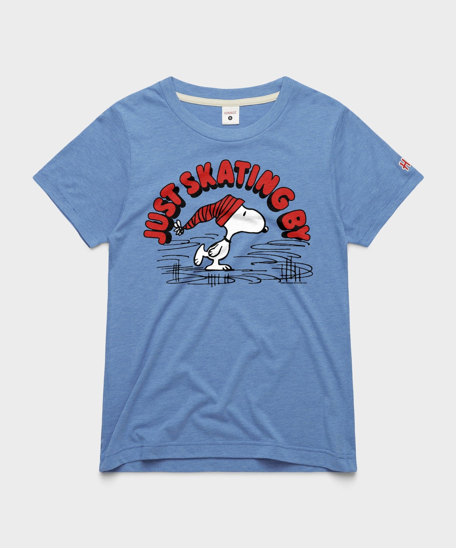 Light blue women's t-shirt featuring Snoopy ice skating on the front chest