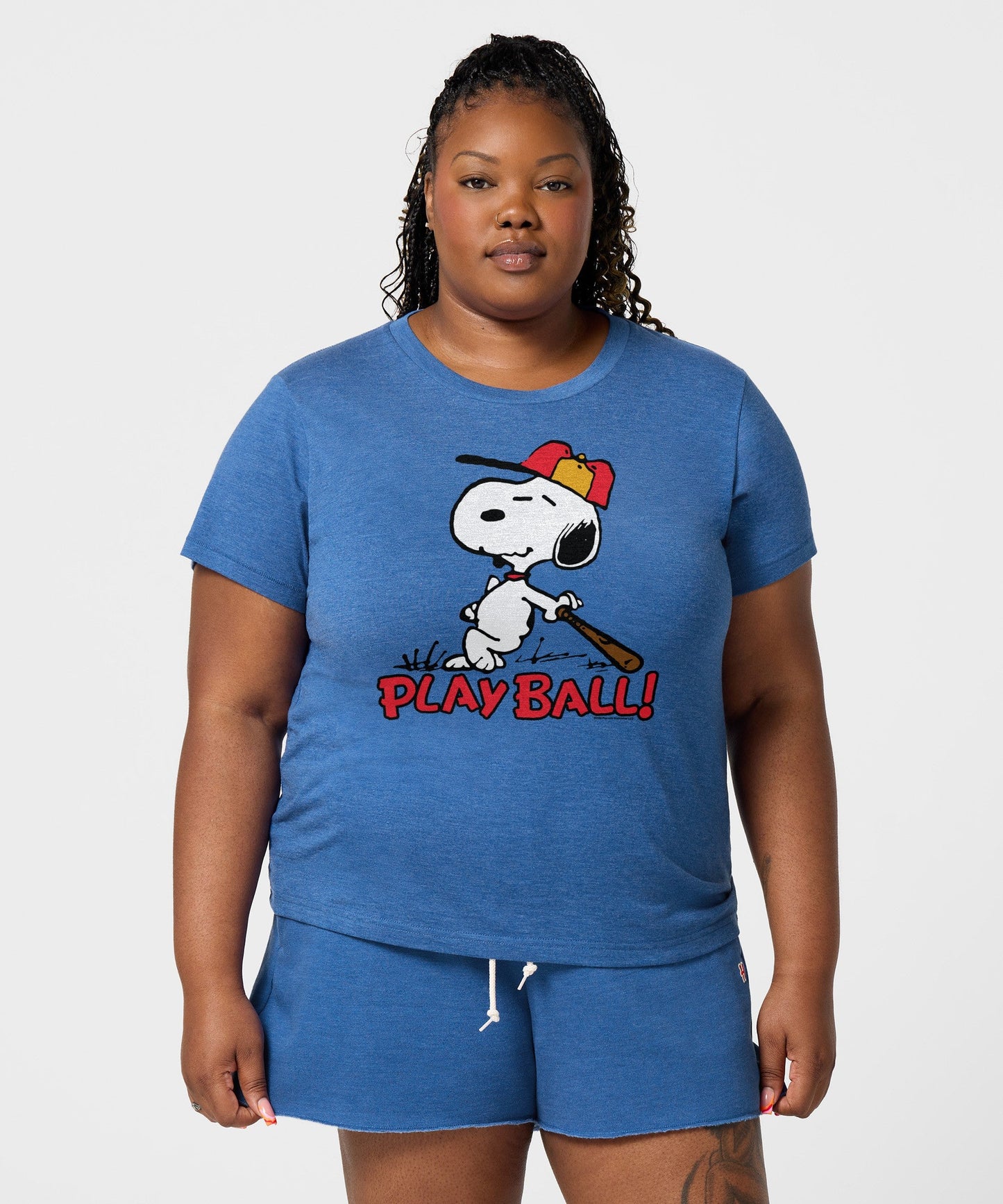 Side view of the royal blue Peanuts t-shirt showing the standard short-sleeve fit