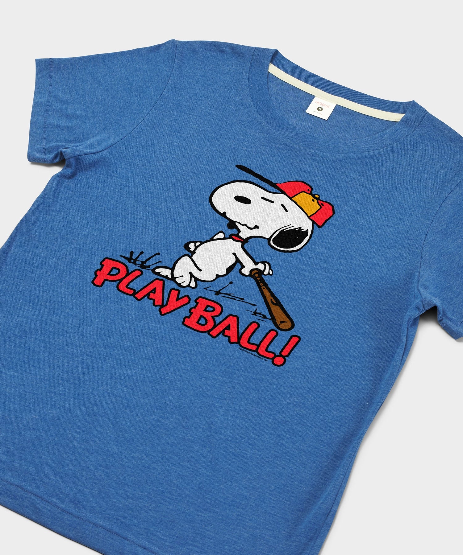 Close-up of the screen-printed Snoopy baseball graphic on the front of the royal blue t-shirt