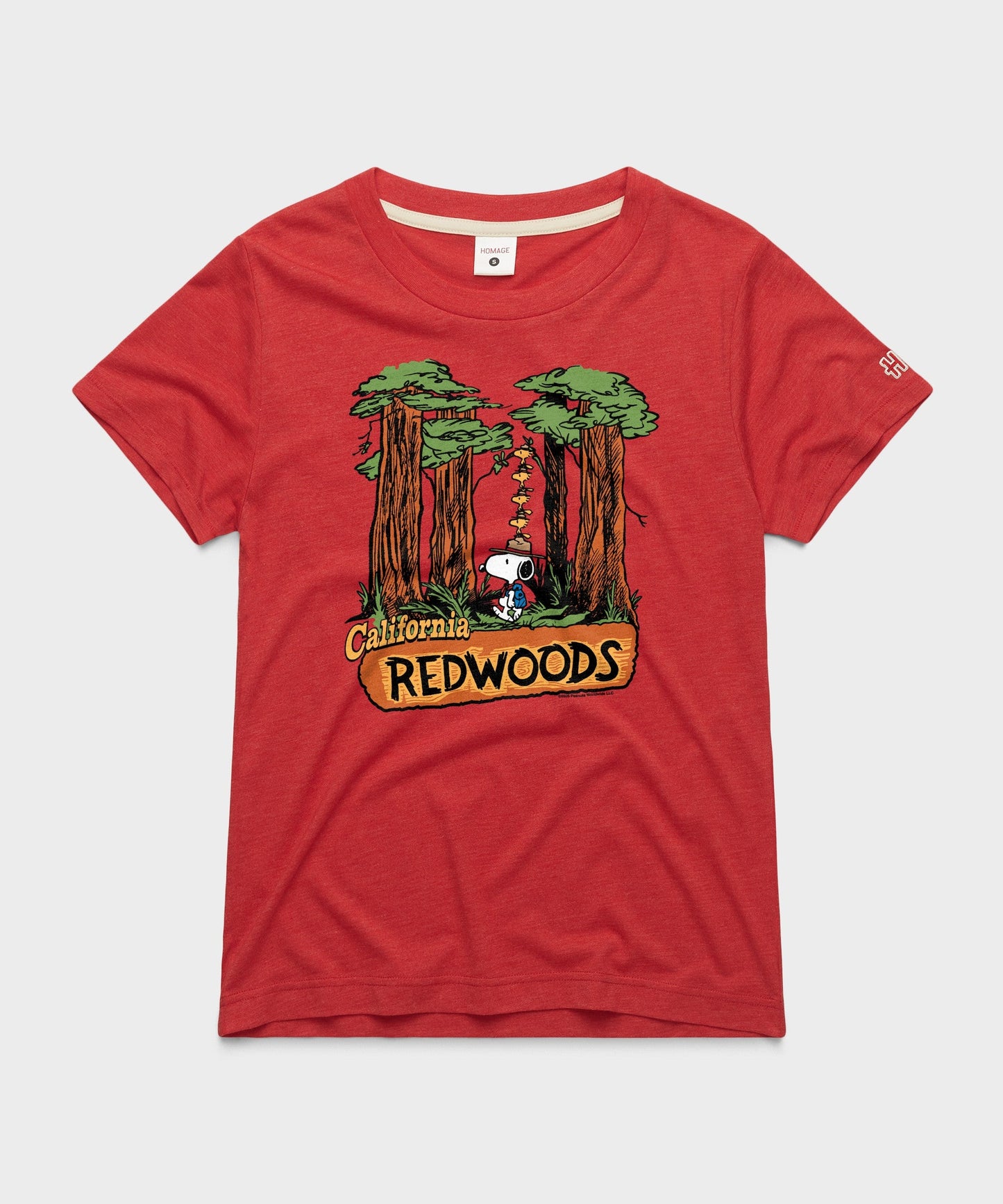 Red women's t-shirt featuring Snoopy exploring the California Redwoods on the front chest