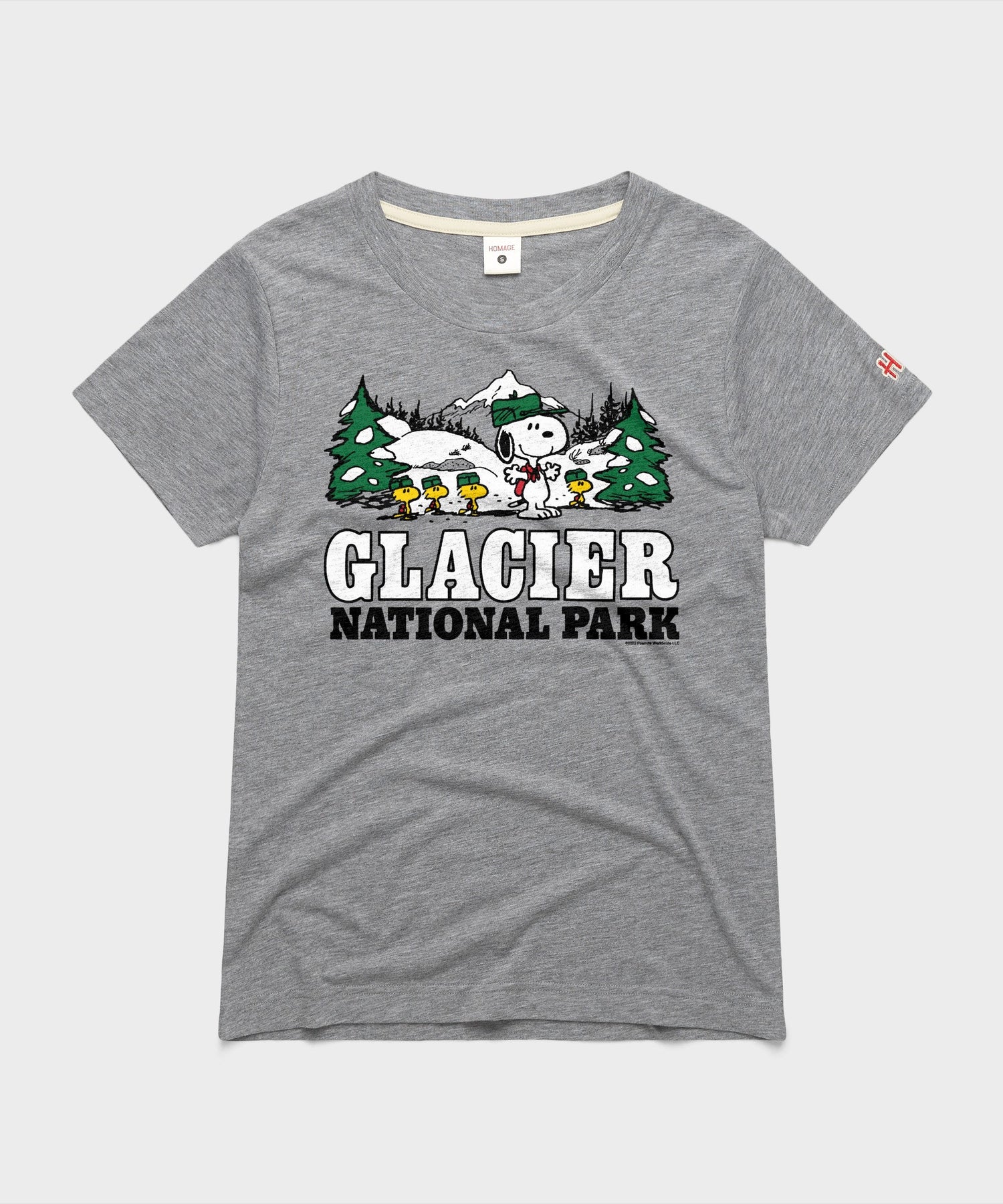 Grey women's t-shirt with a graphic of Snoopy exploring Glacier National Park on the chest