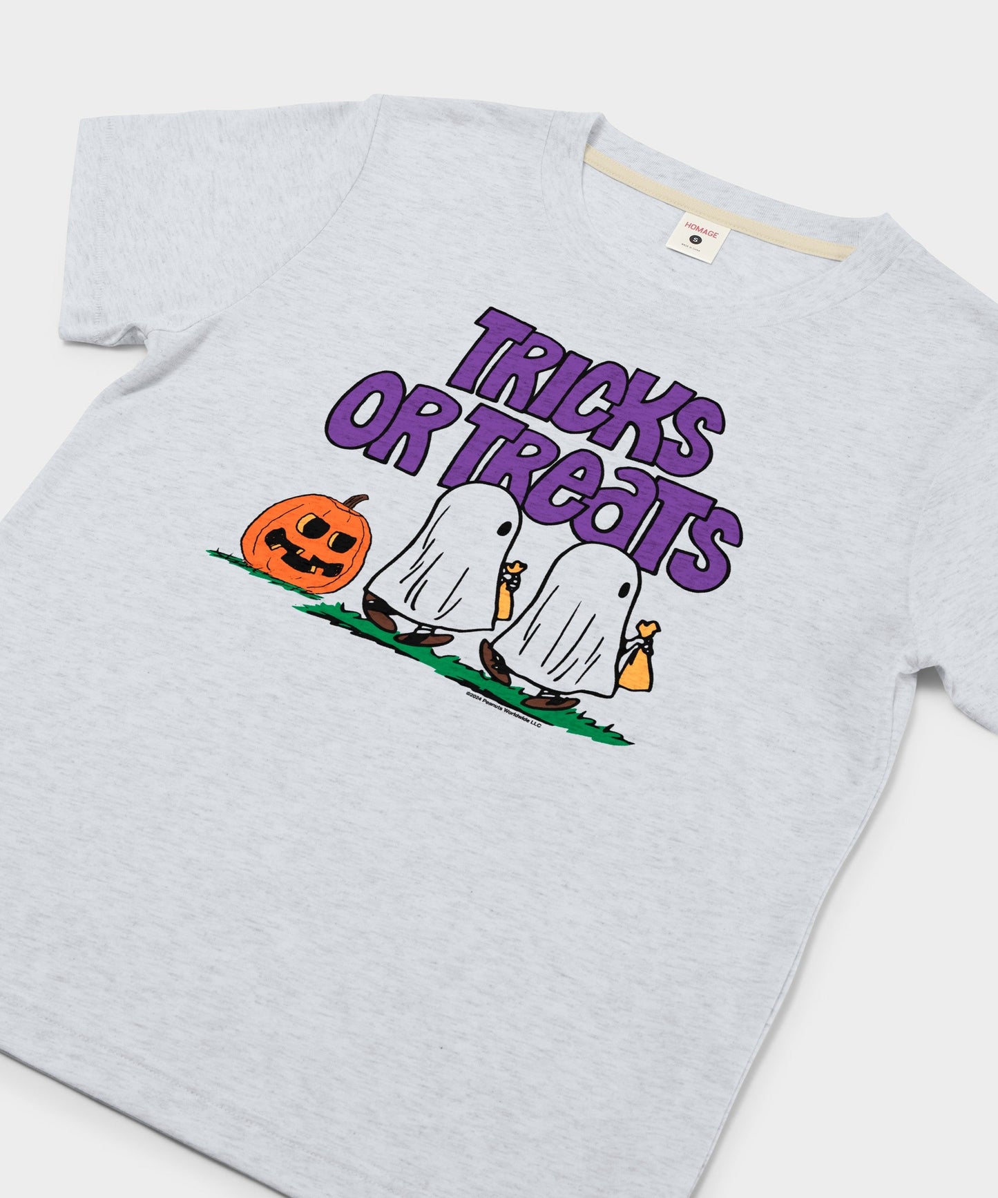 Close-up view of the Tricks Or Treats graphic on the ash cotton t-shirt