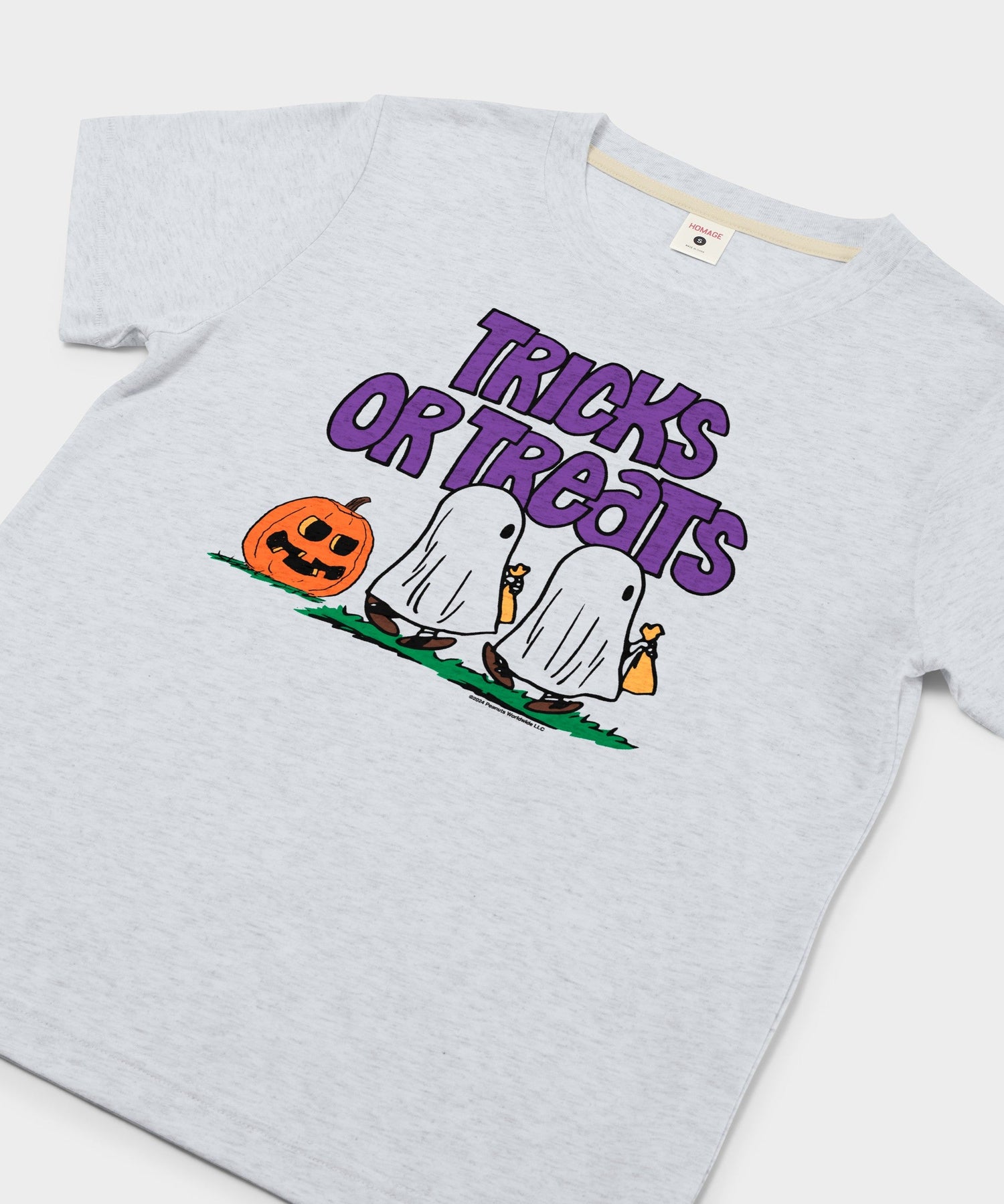 Close-up view of the Tricks Or Treats graphic on the ash cotton t-shirt