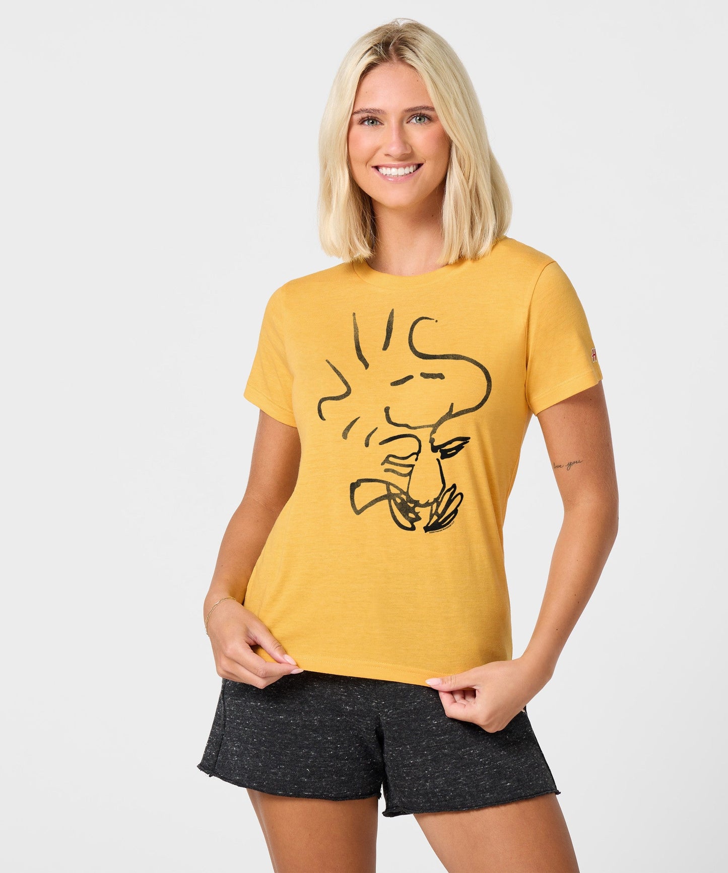 Side view of the women's t-shirt showing the relaxed fit and short sleeves