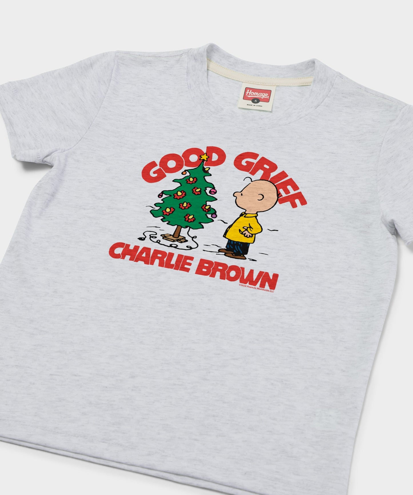 Close-up view of the Charlie Brown Christmas graphic printed on the front of the ash grey youth t-shirt