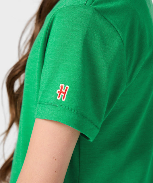 Green youth t-shirt featuring Charlie Brown ready to block a shot on the front-4
