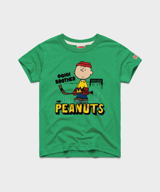 Green youth t-shirt featuring Charlie Brown ready to block a shot on the front-0