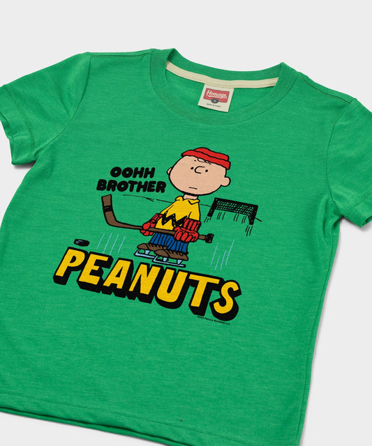 Green youth t-shirt featuring Charlie Brown ready to block a shot on the front-1