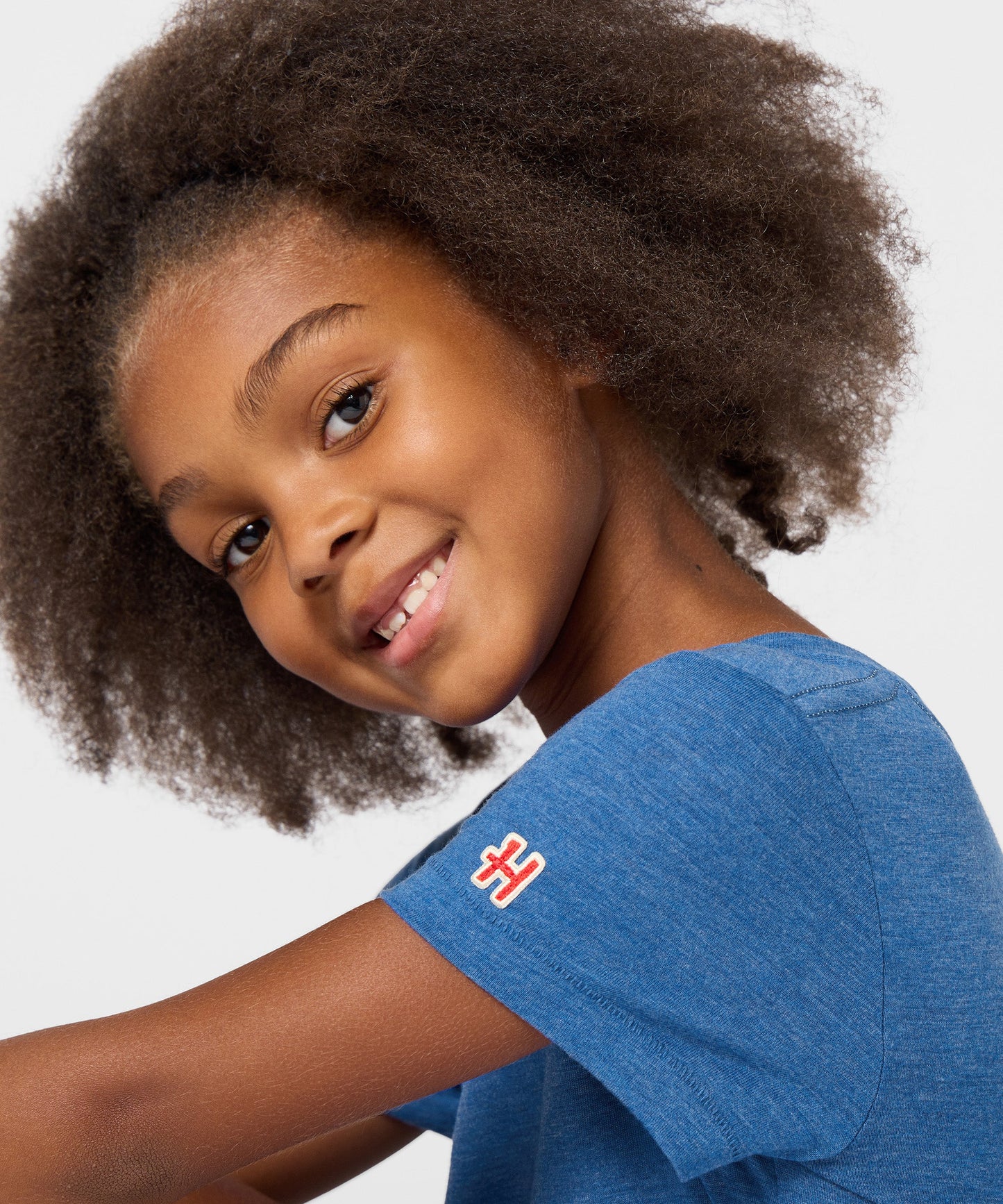 Folded royal blue youth t-shirt showing the vibrant Franklin character design