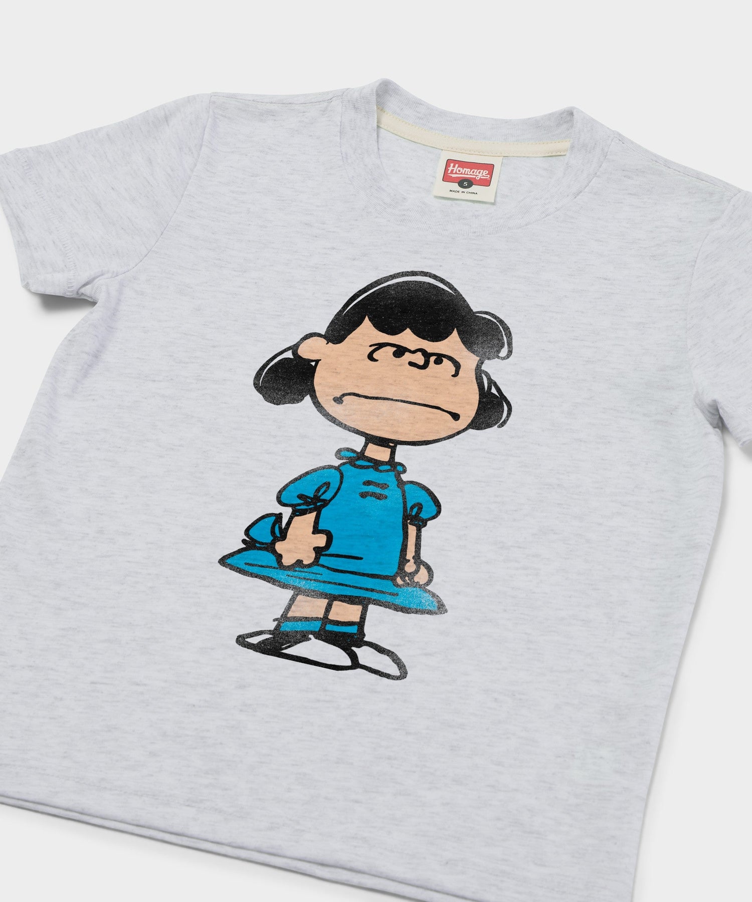 Close-up of the front graphic featuring Lucy van Pelt with her signature confident expression