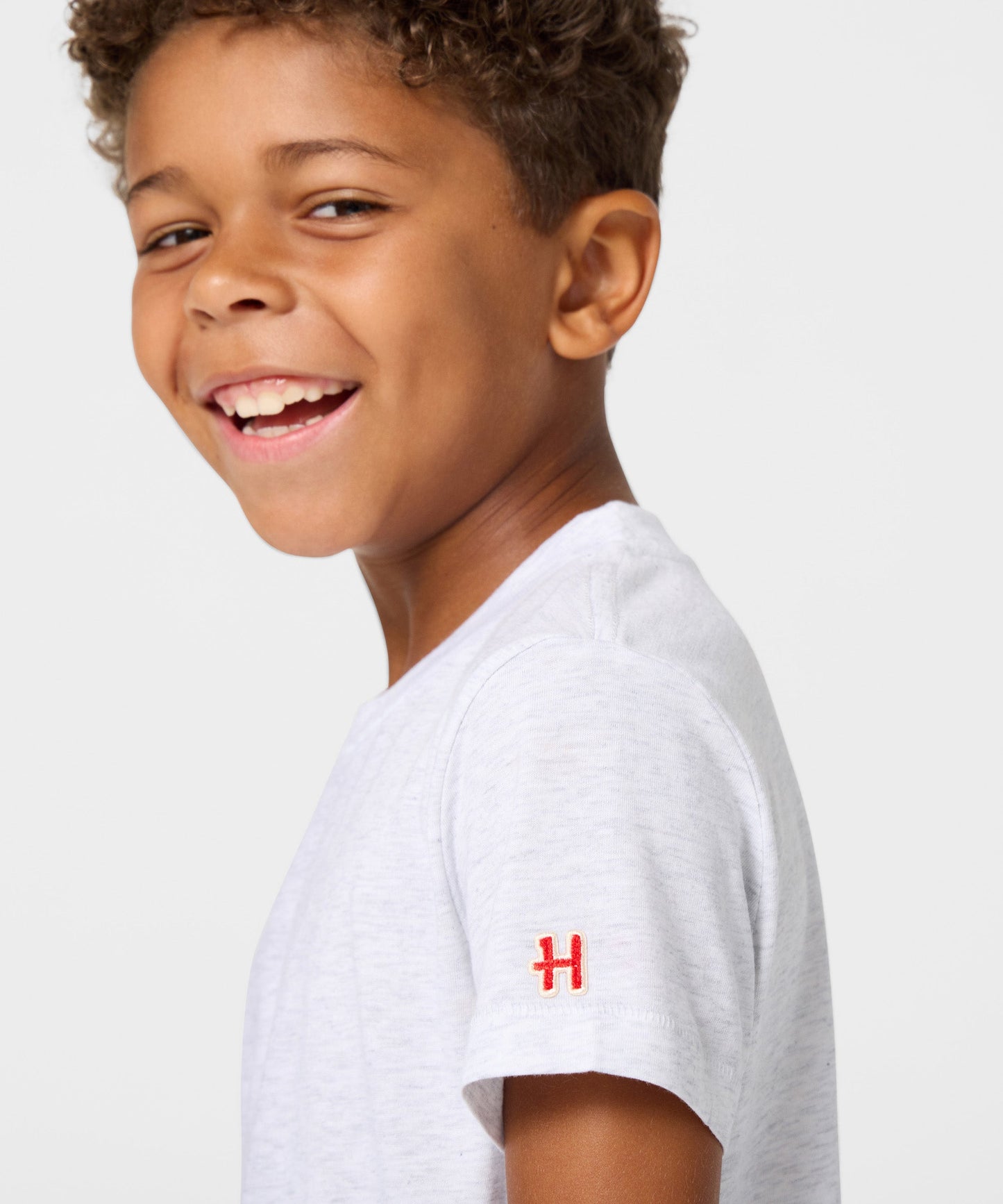 Detailed view of the interior collar tag featuring HOMAGE and Peanuts branding