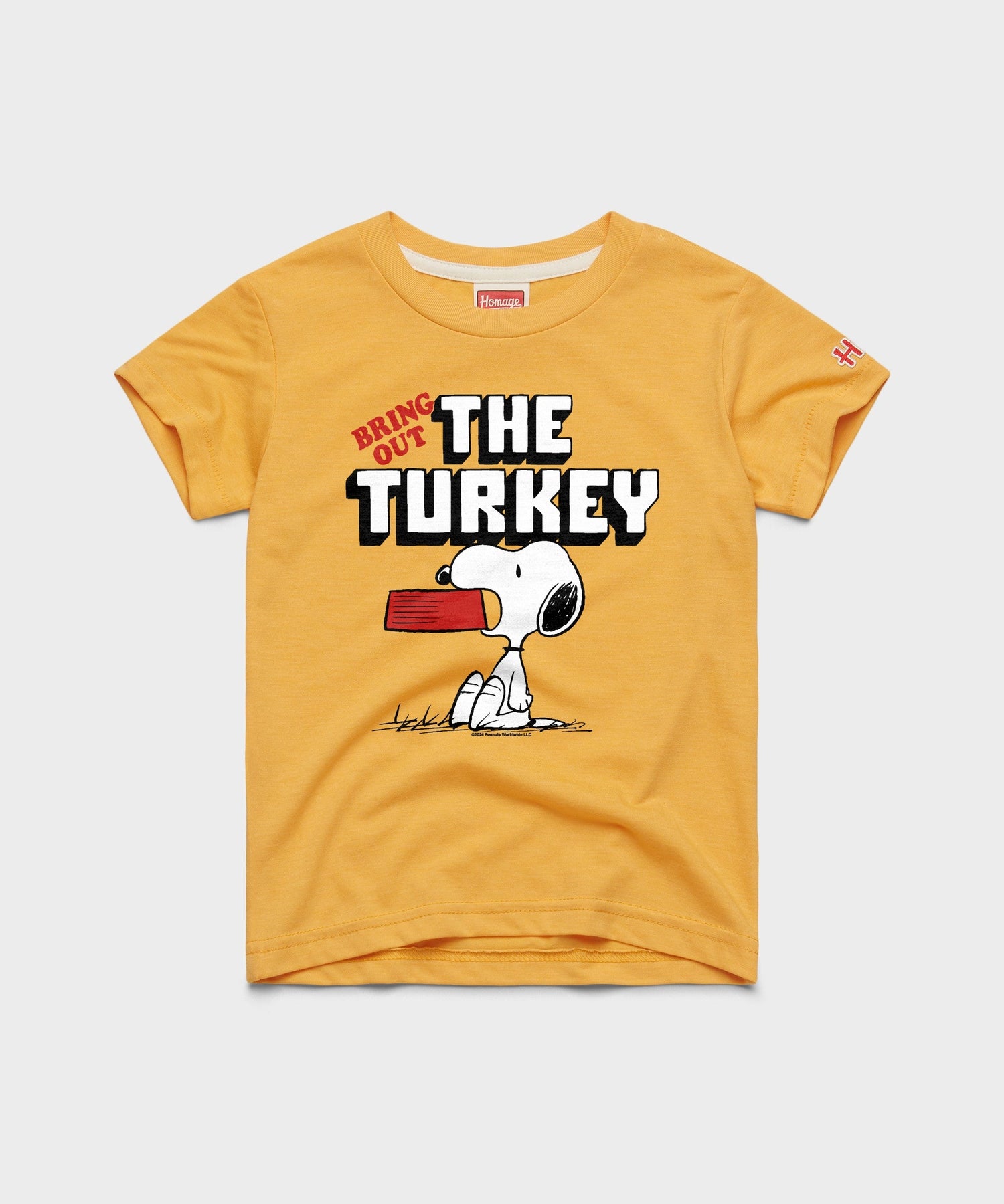 Gold youth t-shirt featuring Snoopy celebrating a holiday feast with the text Bring Out The Turkey across the front chest