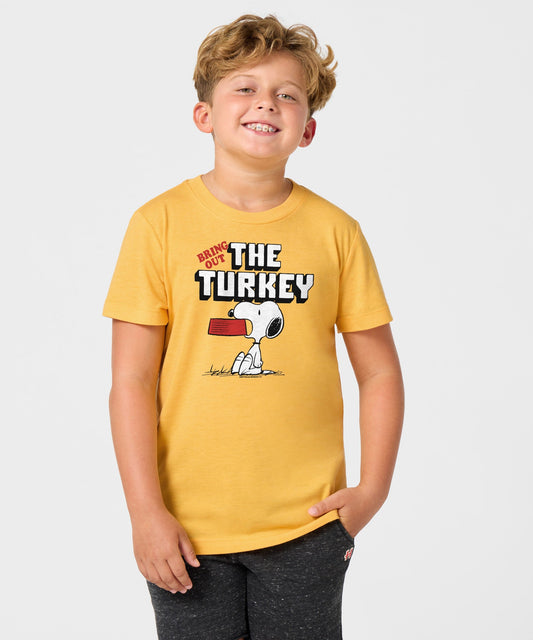 Gold youth t-shirt featuring Snoopy celebrating a holiday feast with the text Bring Out The Turkey across the front chest-2