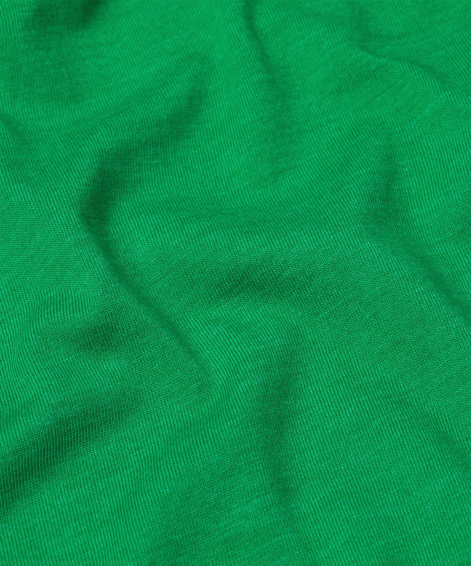 Detailed view of the soft fabric texture and interior collar branding