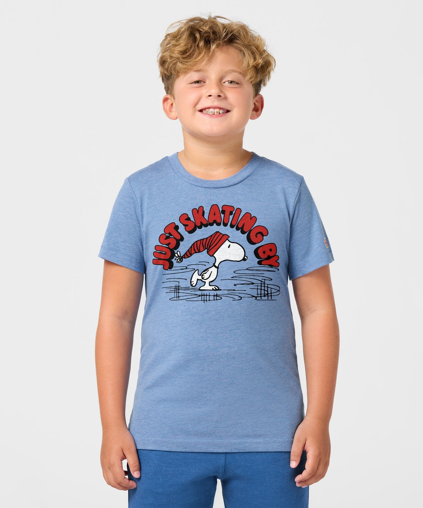 Back view of the light blue youth t-shirt, plain solid fabric