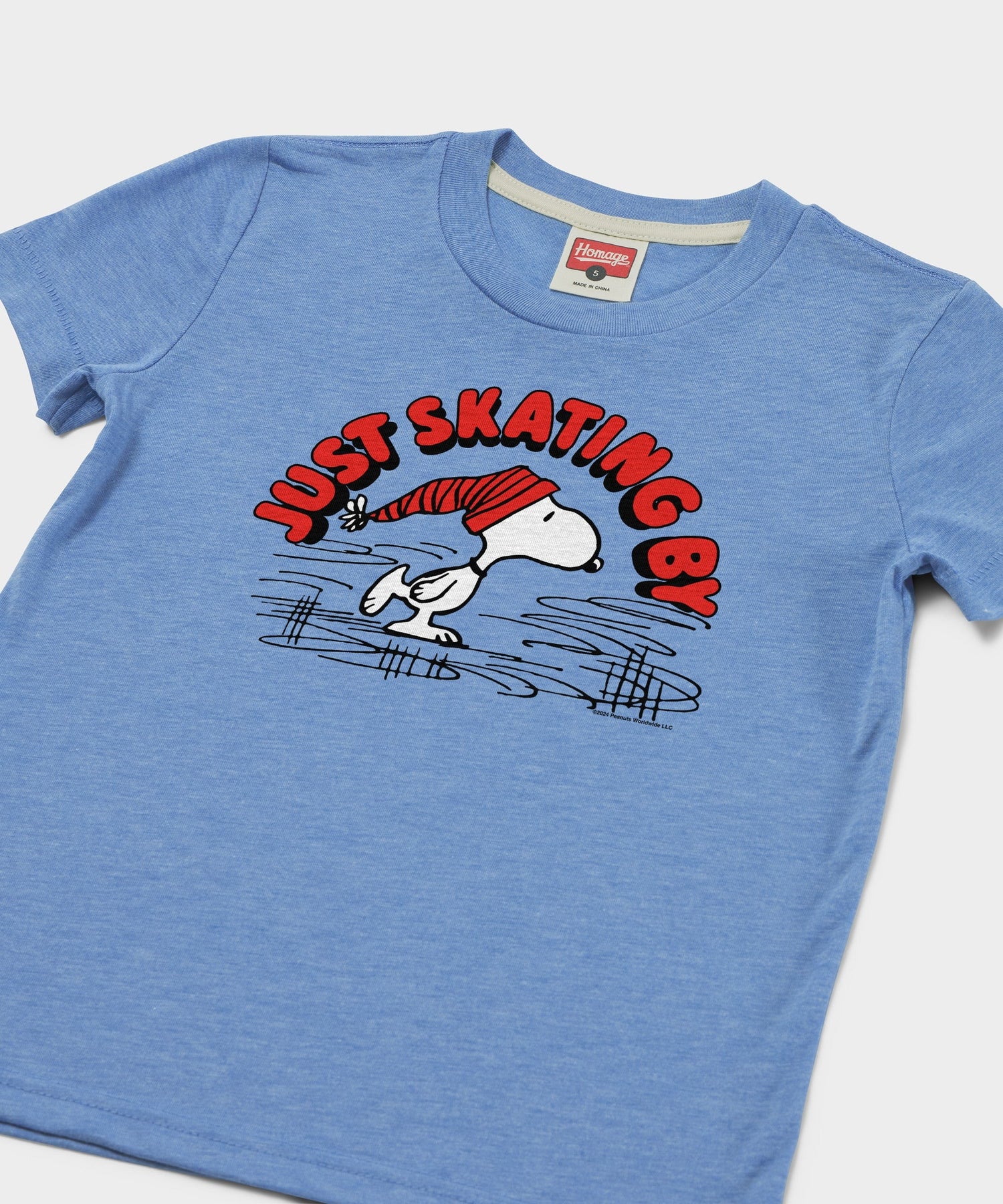 Close-up of the Snoopy Just Skating By graphic print in light blue