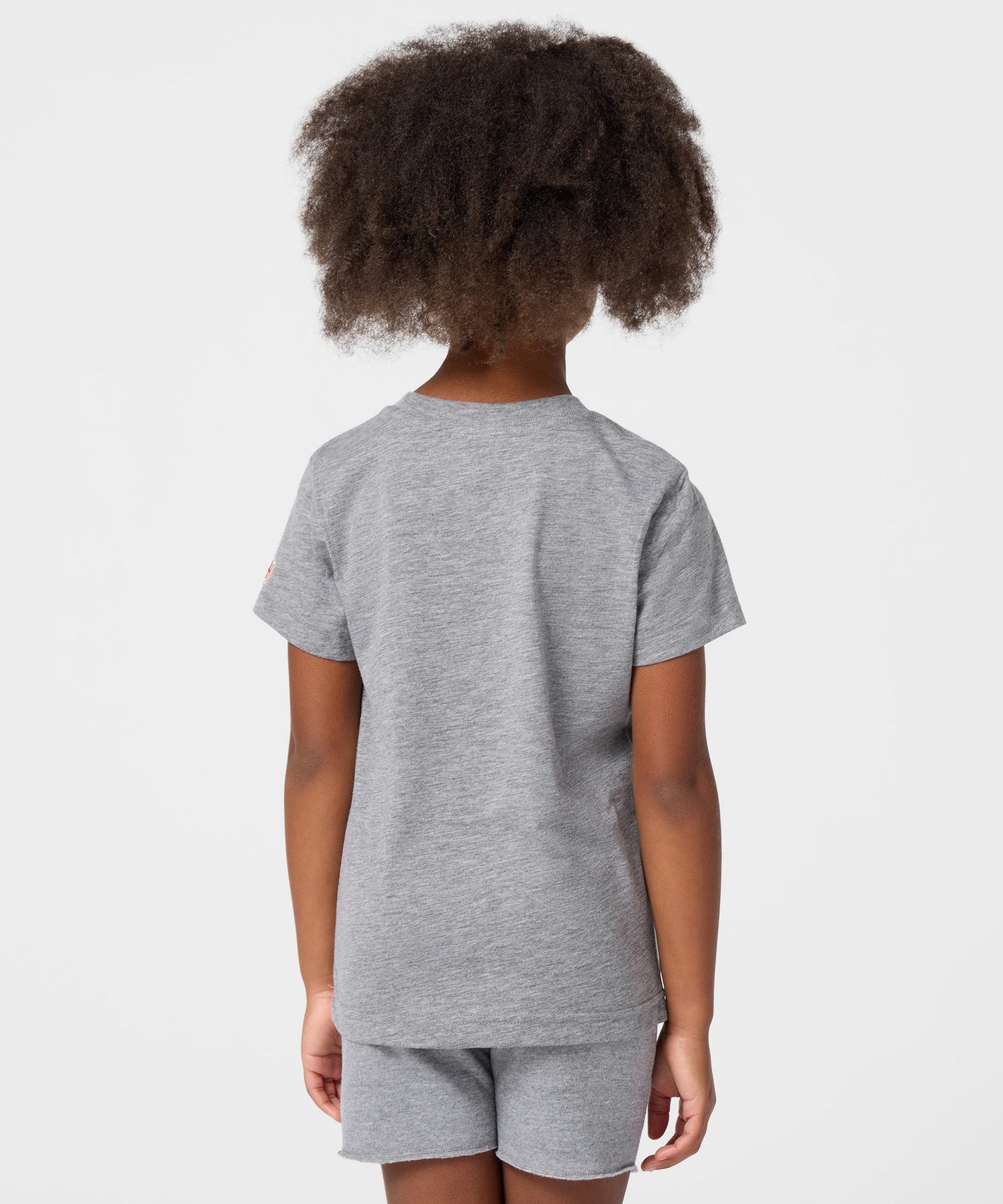 Detailed view of the interior collar and brand tag inside the youth graphic t-shirt
