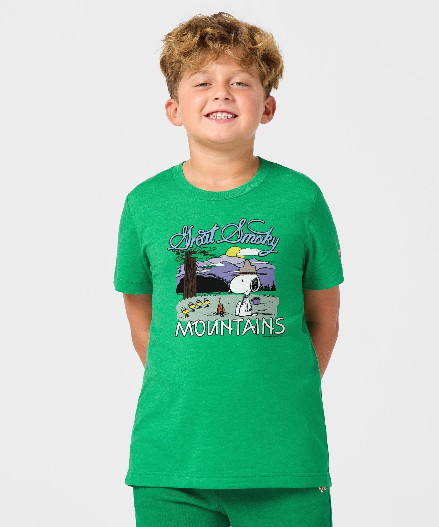 Back view of the solid green youth t-shirt with a blank back and soft fabric texture
