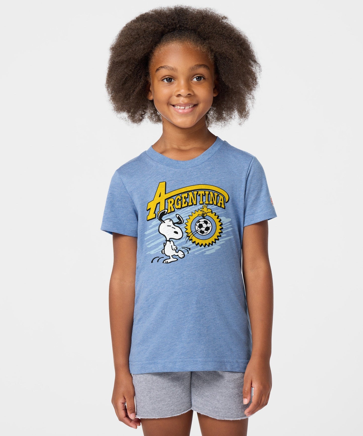 Back view of the light blue youth t-shirt, showing a plain solid back