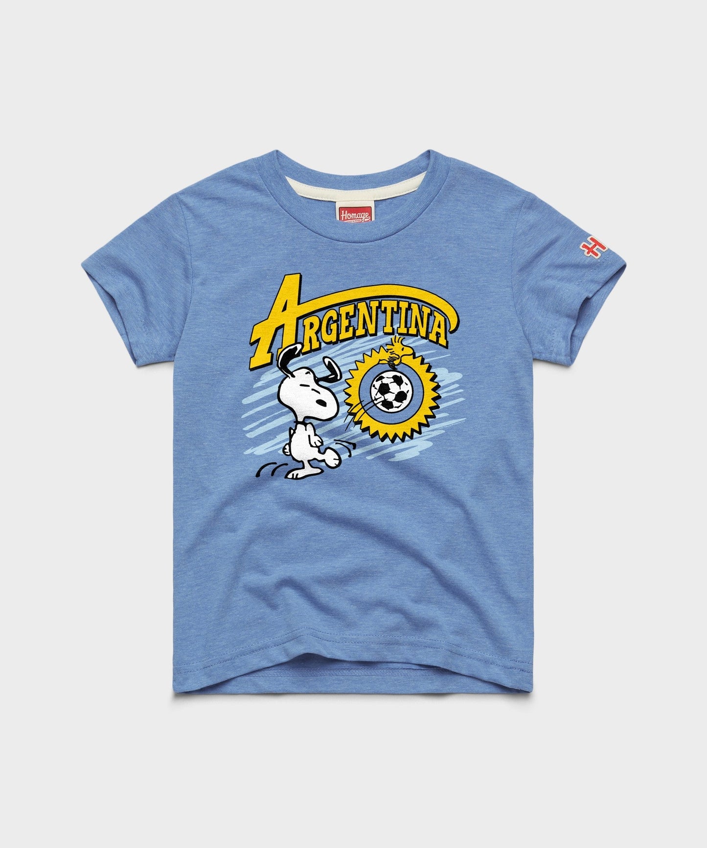 Light blue youth t-shirt featuring Snoopy in an Argentina soccer design centered on the front