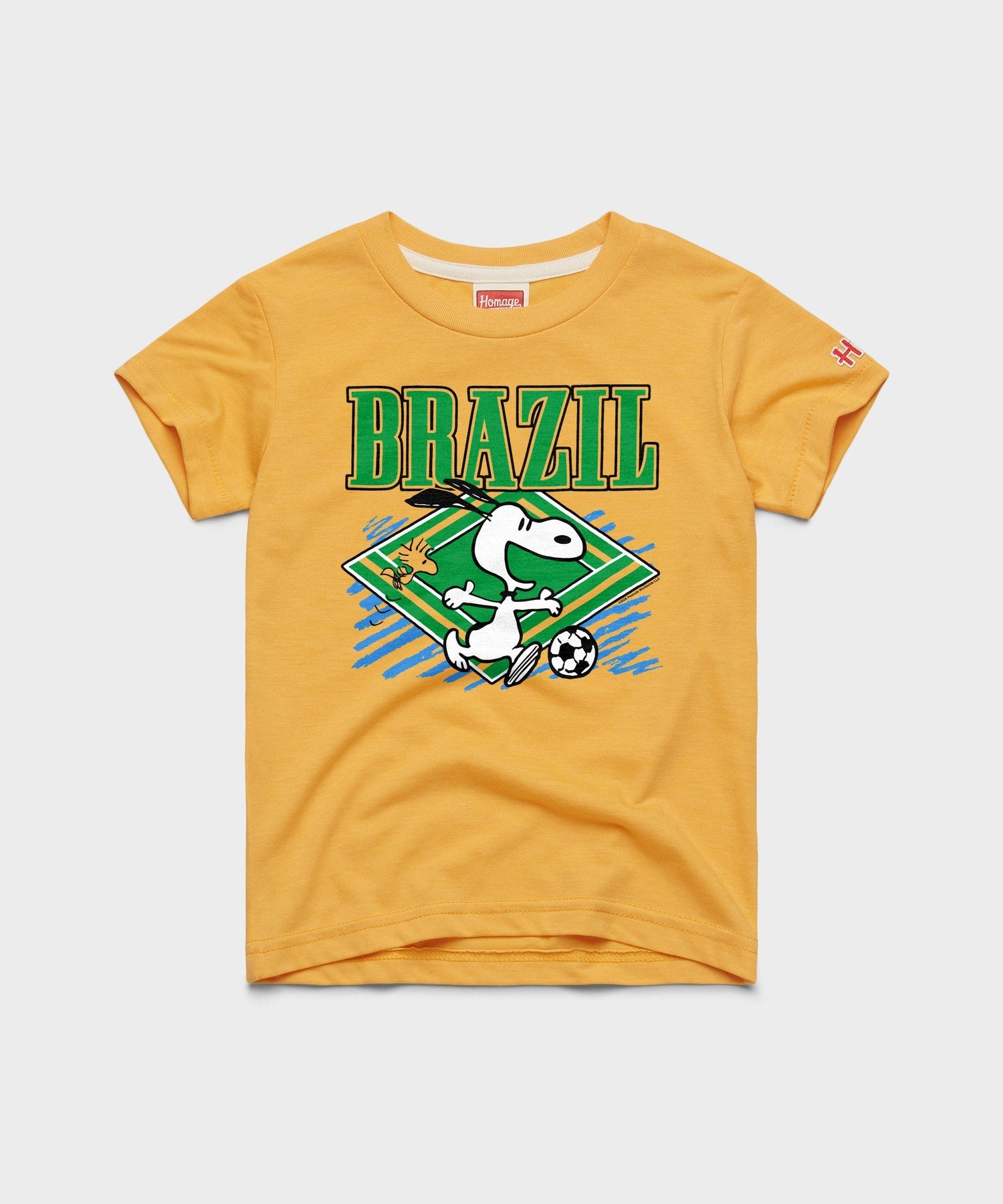 Gold youth t-shirt featuring Snoopy with a soccer ball on the front chest