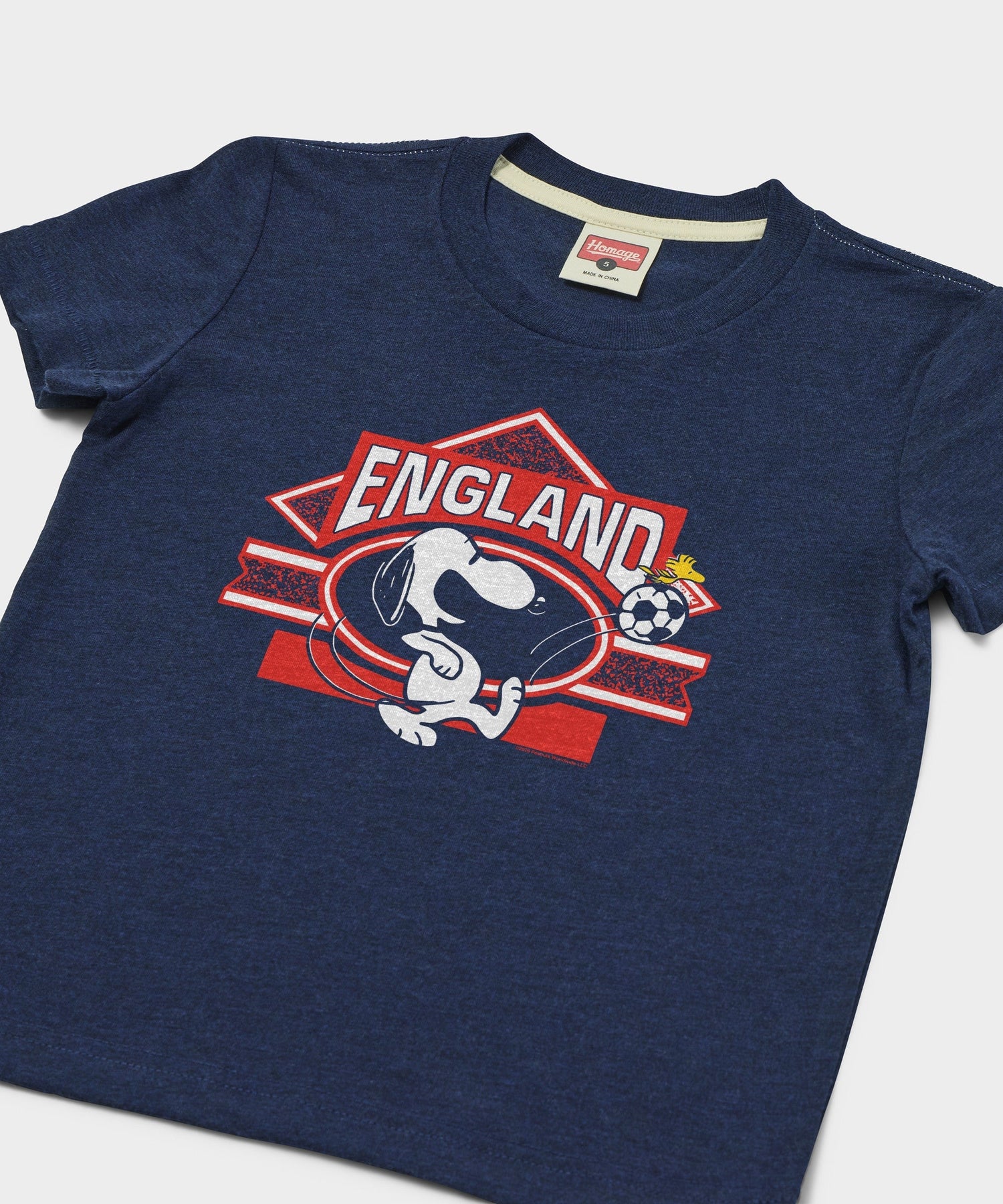 Close-up of the Snoopy and England soccer graphic printed on the front
