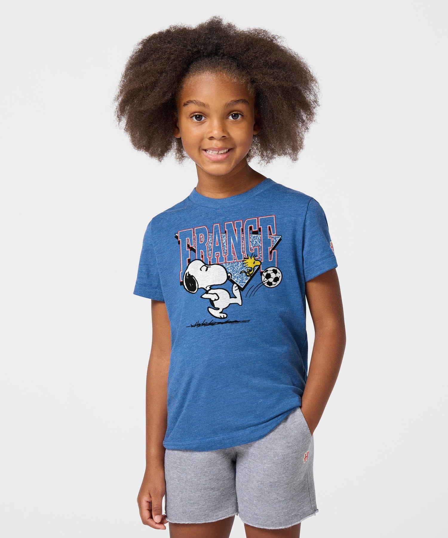 Back view of the royal blue youth t-shirt, showing a clean solid design