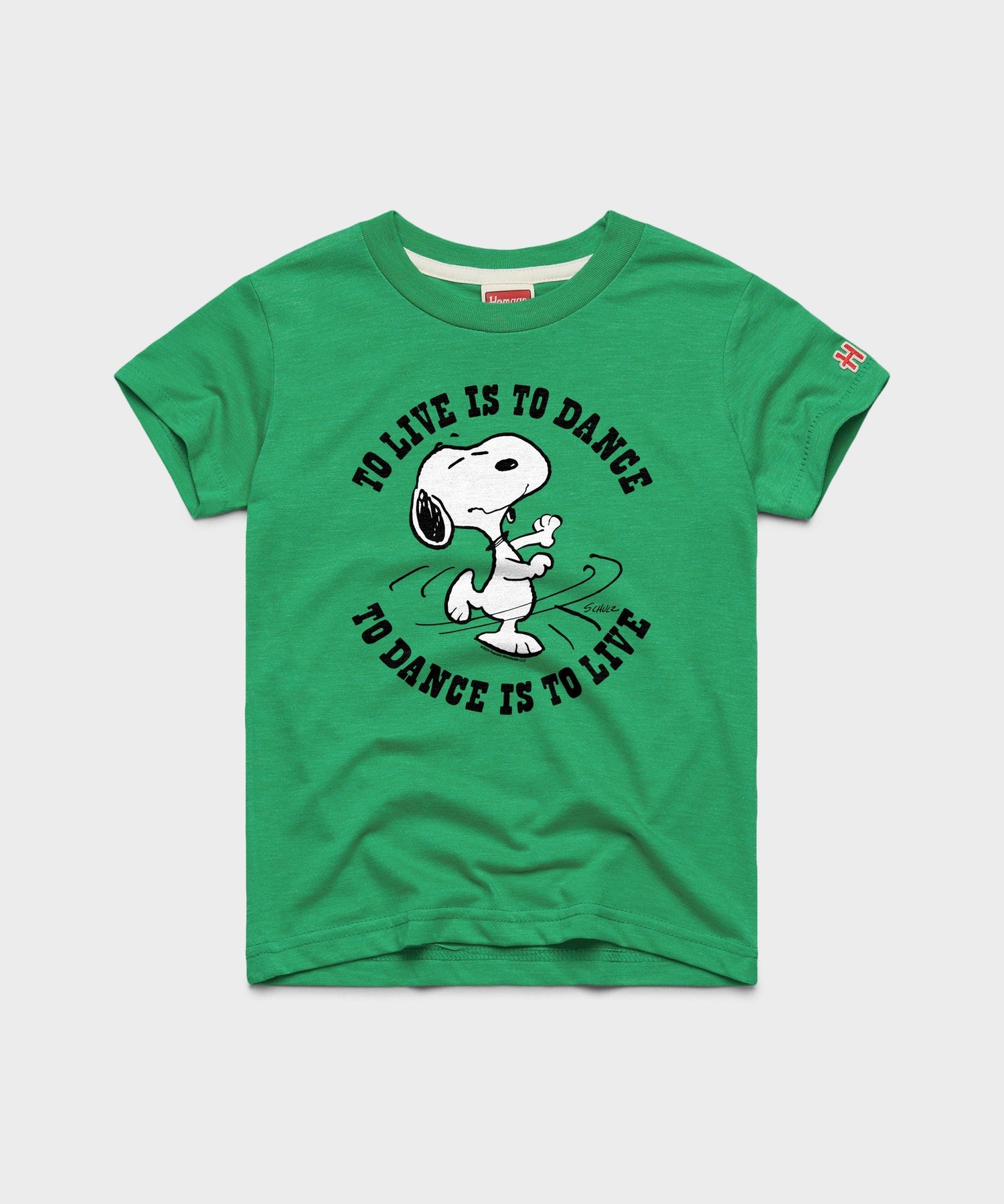 Green youth t-shirt featuring Snoopy dancing on the front chest with HOMAGE branding