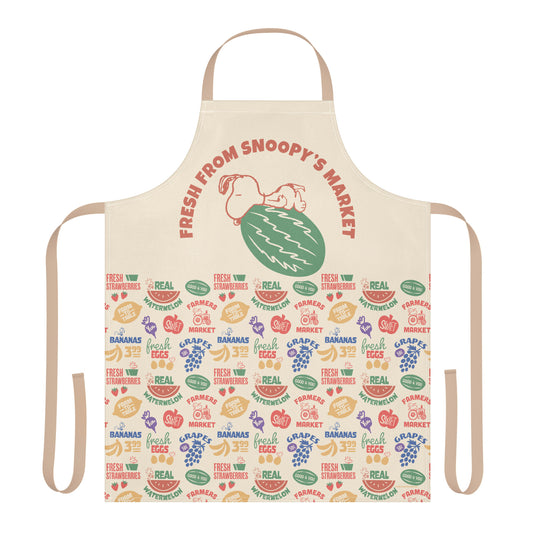A white Peanuts bib apron featuring a graphic of Snoopy at a market stall with the text Fresh From Snoopy’s Market.-0