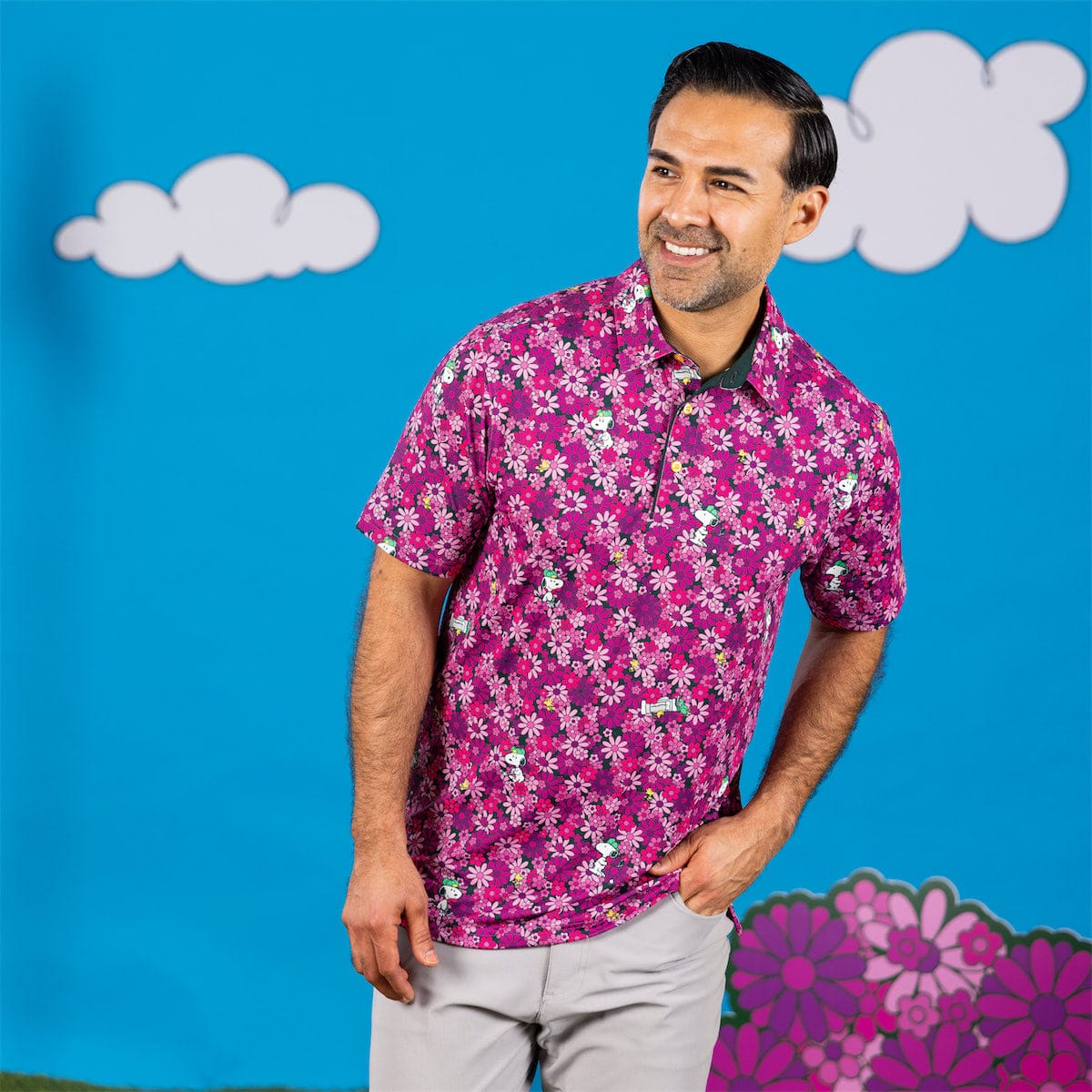Close-up of the polo collar and button placket with vibrant floral print