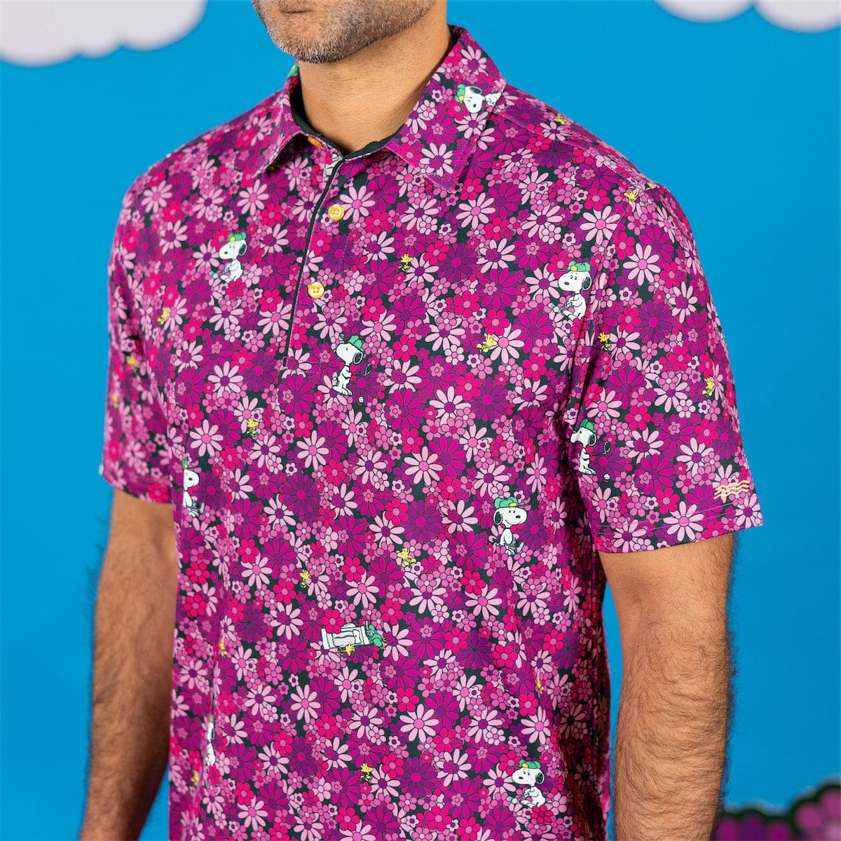 Woodstock flying as a caddie graphic detail on the polo fabric