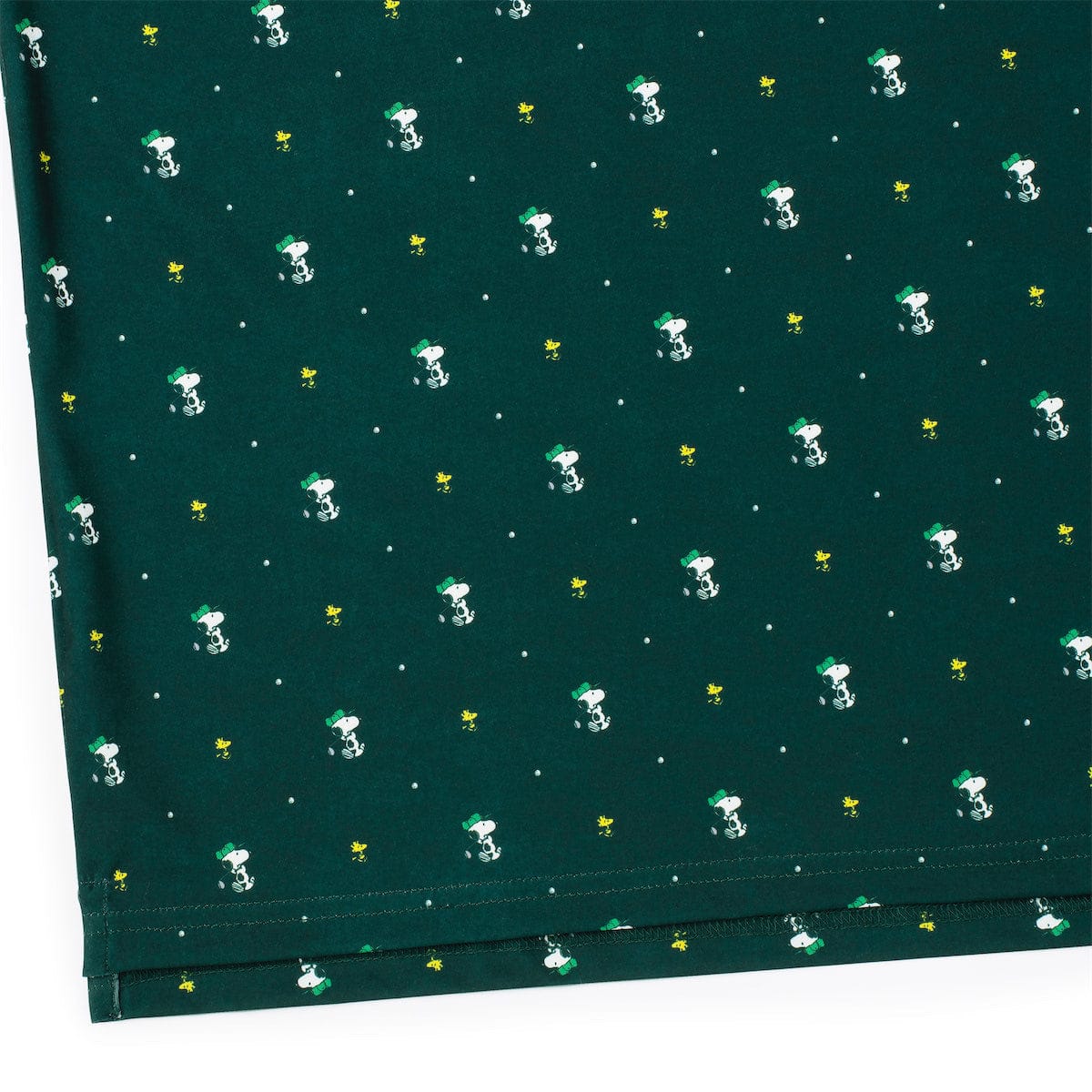 Folded presentation of the Birdie and Beagle Peanuts polo