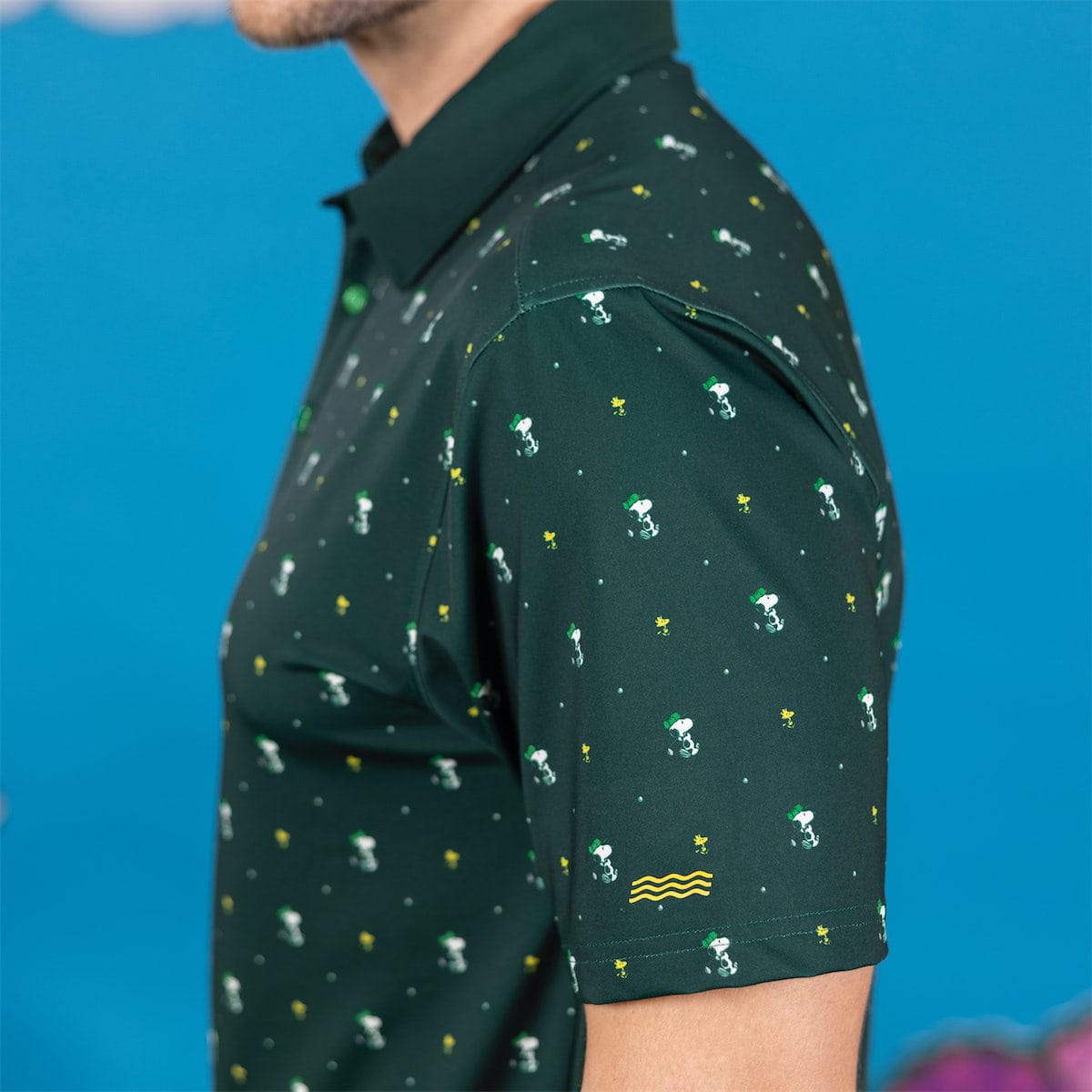 Detailed view of the hem and stitching on the Peanuts golf polo